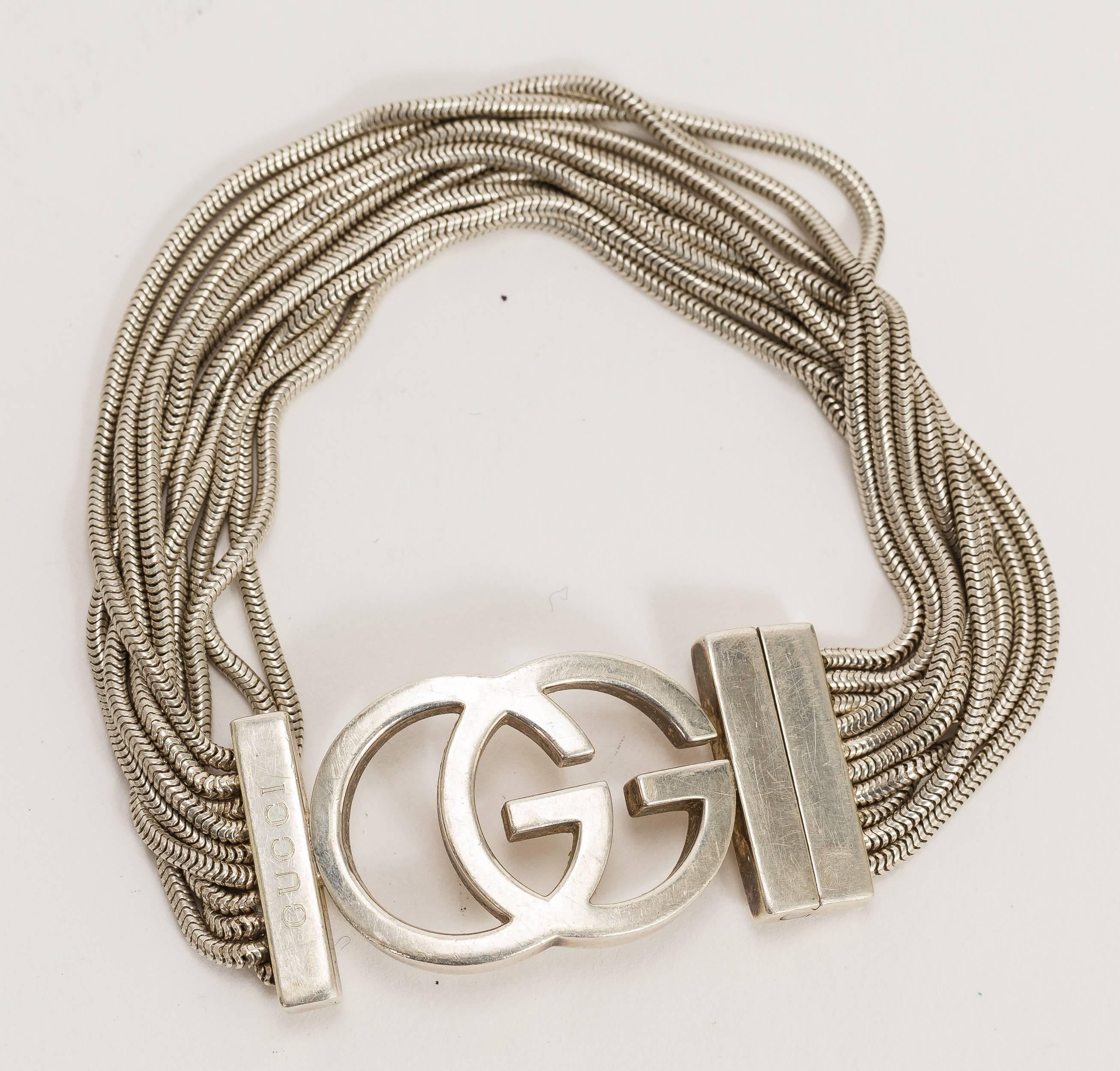 Gucci sterling silver interlocking G's logo multi-stranded snake chain bracelet. Sophisticated roll and slide locking mechanism. Stamped 
