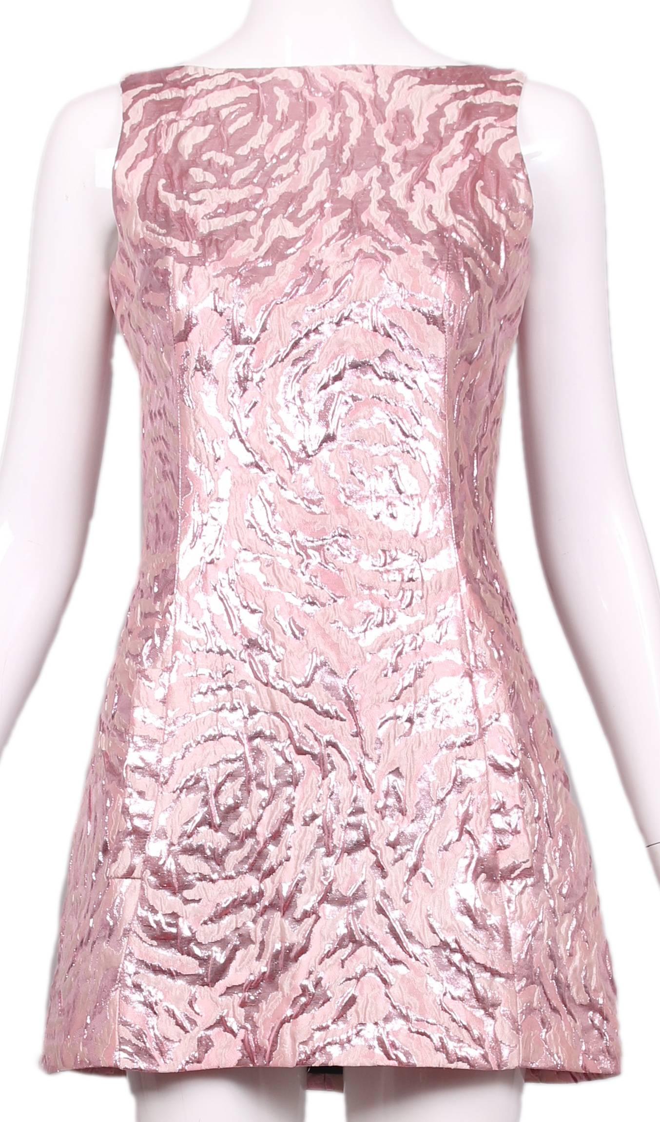 A Balenciaga sleeveless, crew-necked metallic pink abstract print mini dress. Features two frontal pockets, lined at the interior and zippers up the back. In excellent condition. Size tag 36.
MEASUREMENTS (in inches):
Bust - 32
Waist - 27
Hips -