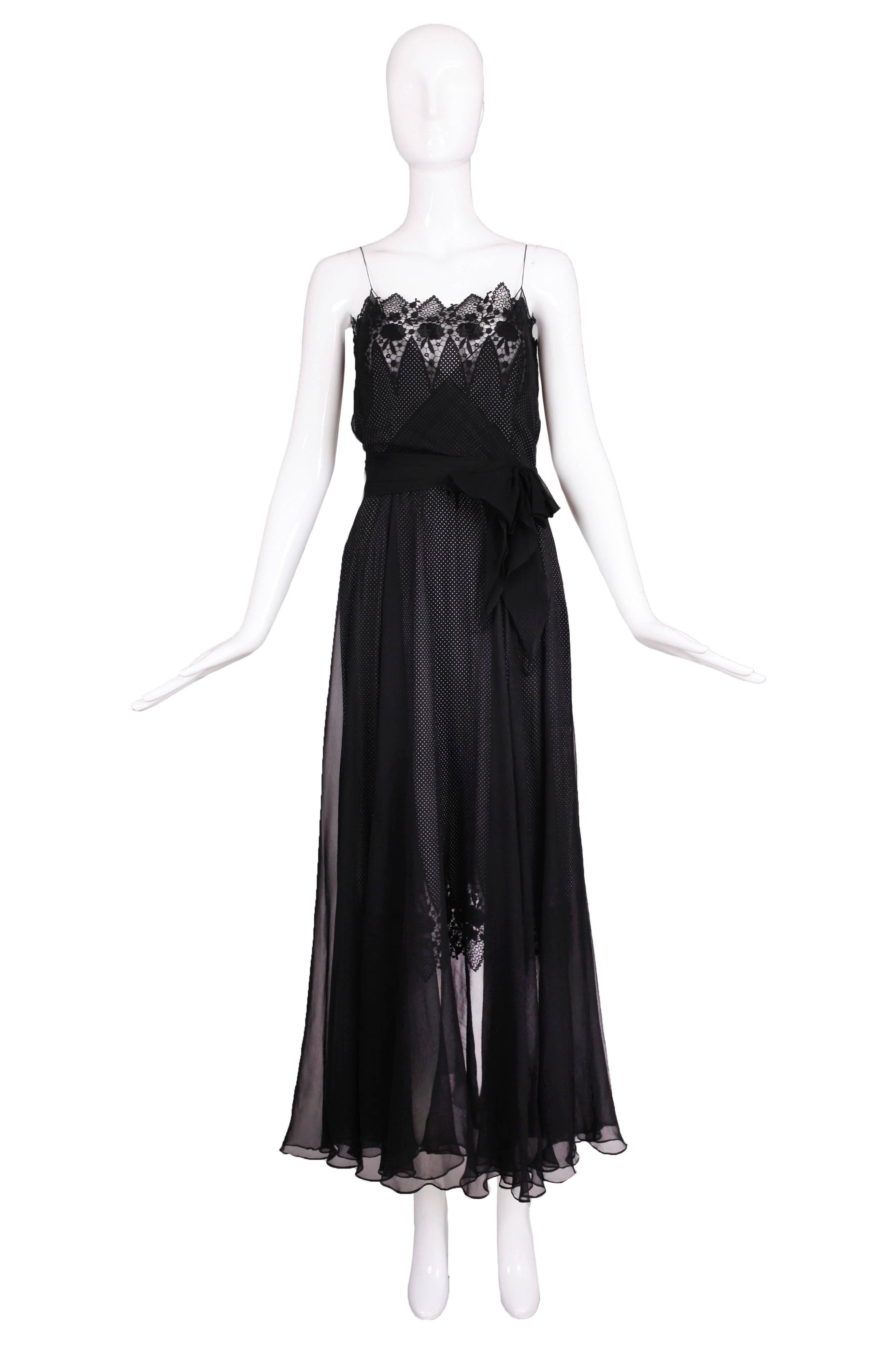 A circa 1980 Nina Ricci by Gerard Pipart haute couture black spaghetti strap silk chiffon evening gown with a layer of polka dot silk fabric and lace trim underneath a layer of black silk chiffon. Lace trim at bodice and edge of polka dot fabric