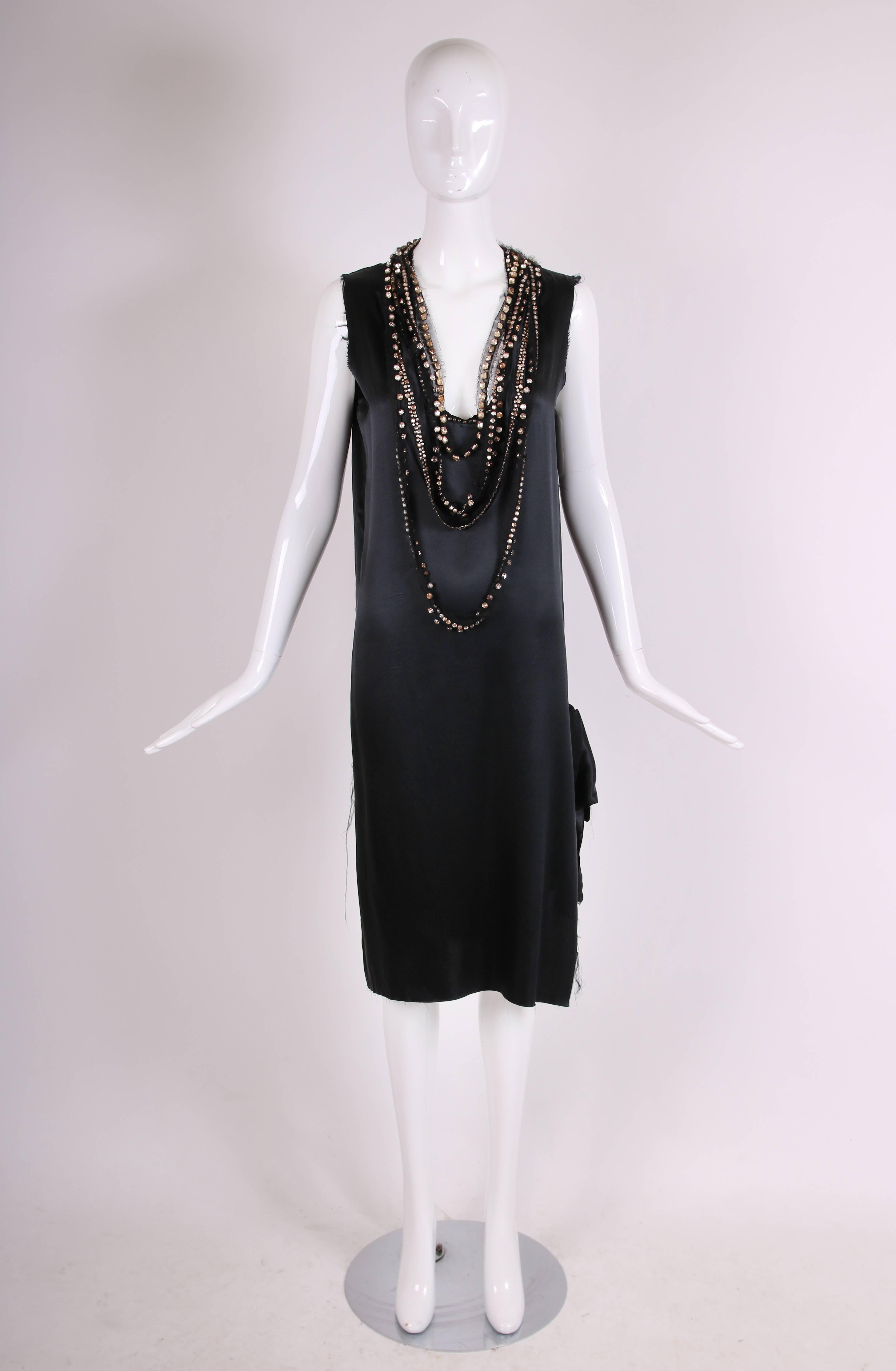 Lanvin by Alber Elbaz black silk evening dress with side ties and multiple strands of rhinestone encrusted tulle strands mixed together and attached at the neck. Purposefully unfinished seams. Size tag 40. In excellent