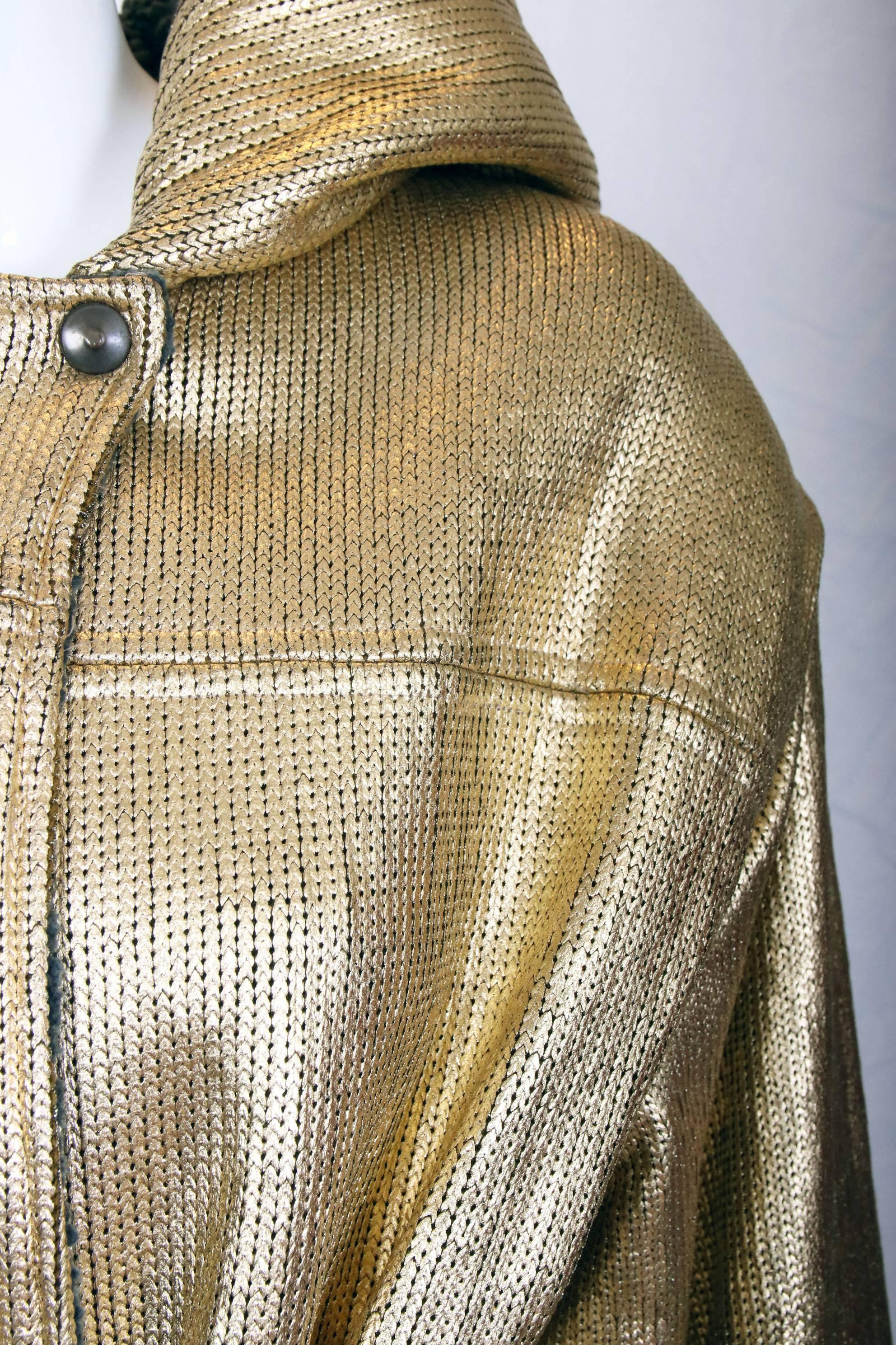 Gianfranco Ferre oversized gold hooded jacket w/bulky waist tie and lambswool blend interior. The jacket is made of an acrylic fiber transfer fibre - which I have no idea what that is. It's some kind of stretchy knit that looks as if it was painted