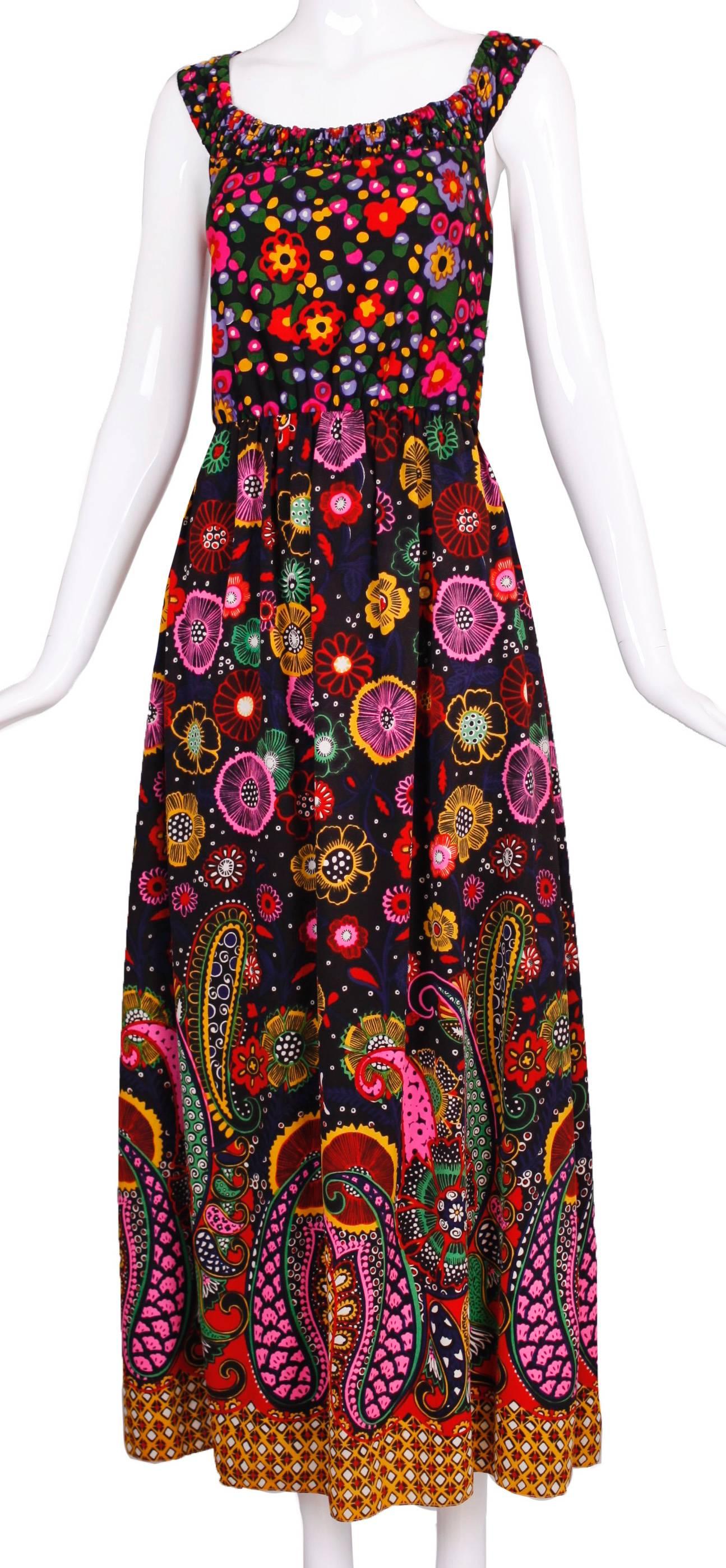 1970s Oscar de La Renta maxi dress with a psychedelic pattern. The straps are elastic, there is a zipper in the back and the skirt is lined in either rayon or silk. No fabric tag but my guess is that it is a silk and poly blend. Size tag is 6 but