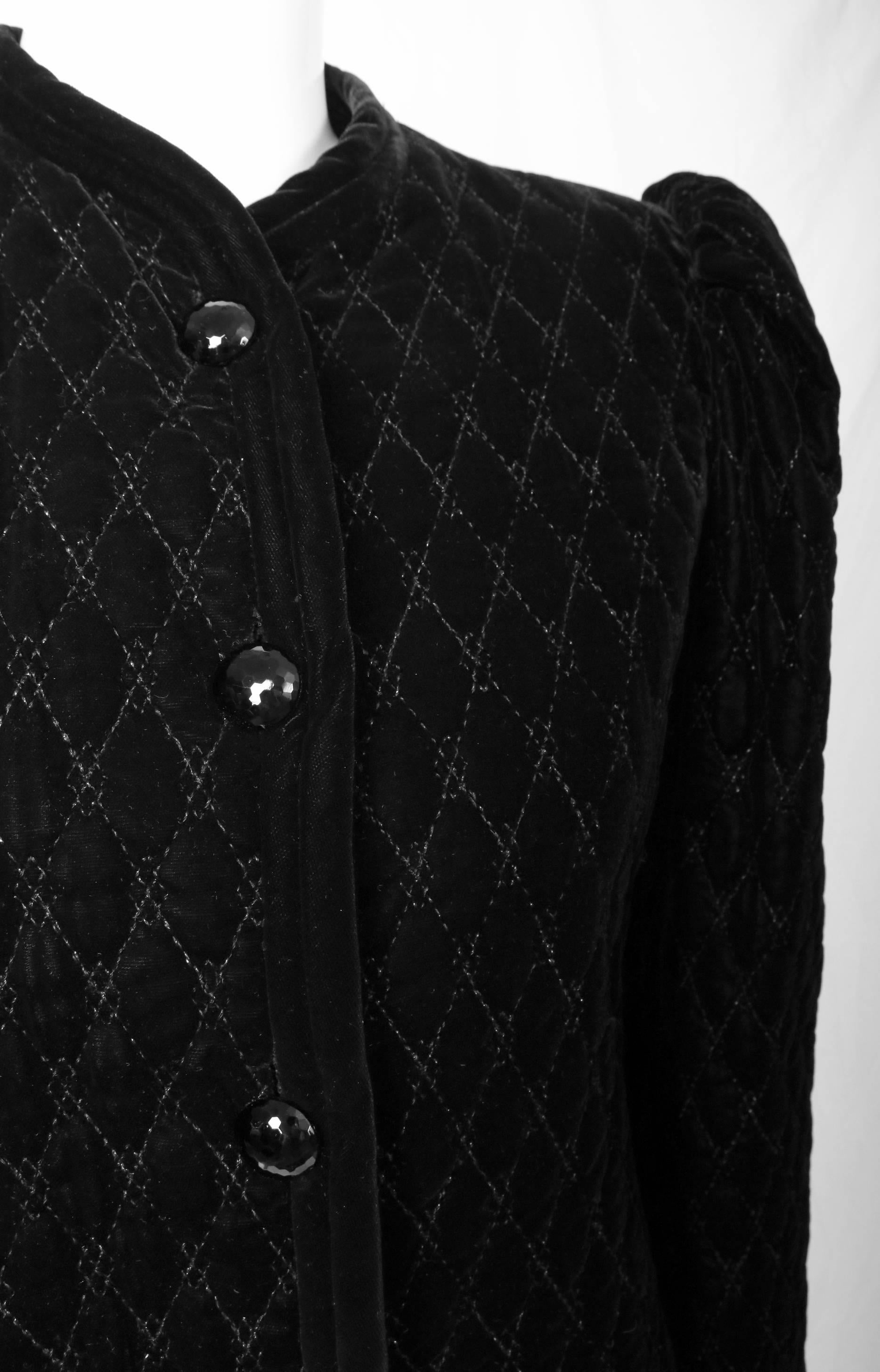 Vintage Yves Saint Laurent black velvet quilted jacket with puffed sleeves and black faceted buttons. Features silk lined interior. Size tag 40. In excellent condition.
MEASUREMENTS:
Shoulders - 15