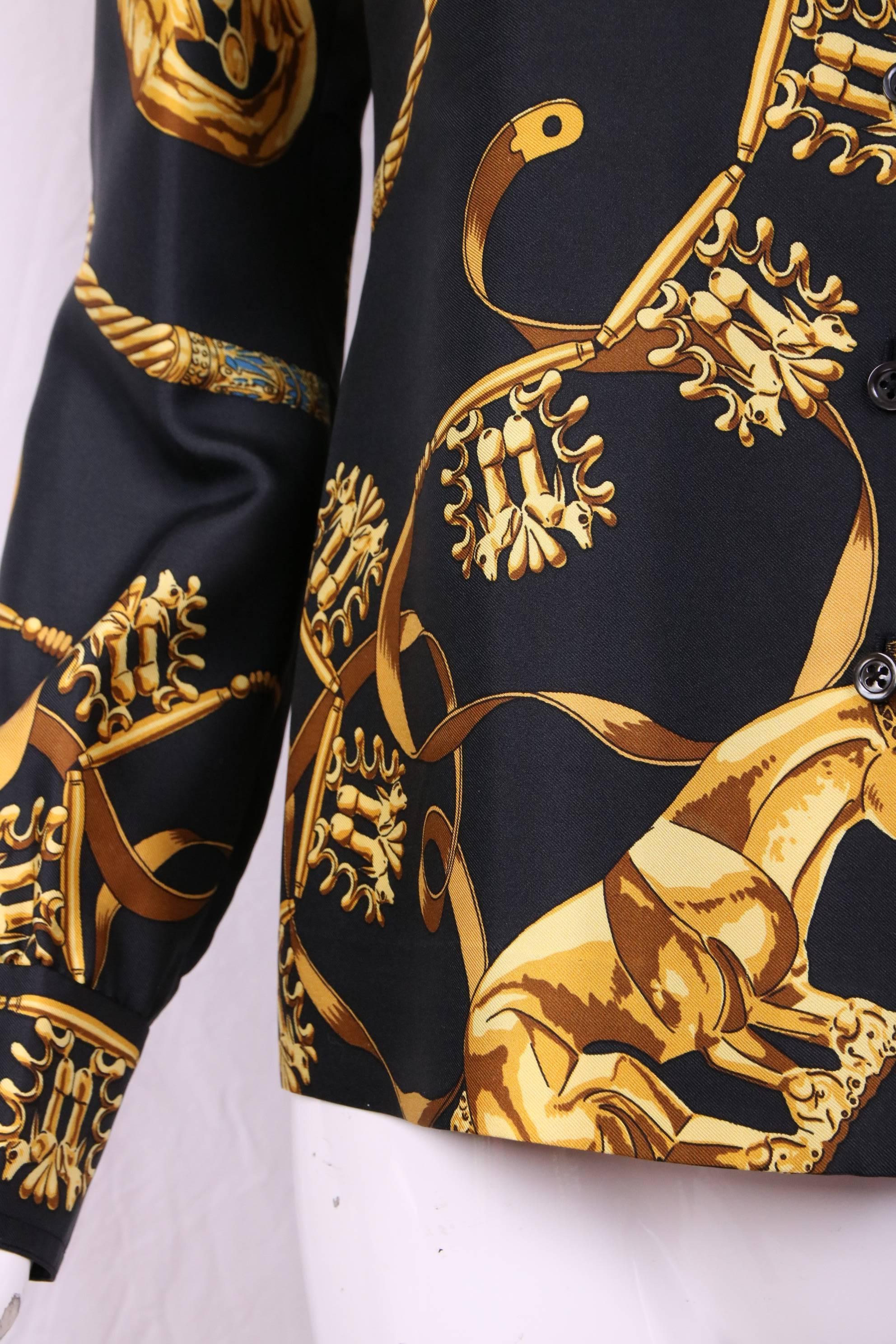 A vintage Hermes black and gold print silk blouse without an Hermes label at back neck. My guess is that this was expertly made from two authentic Hermes scarves. In excellent condition. No size tag please consult