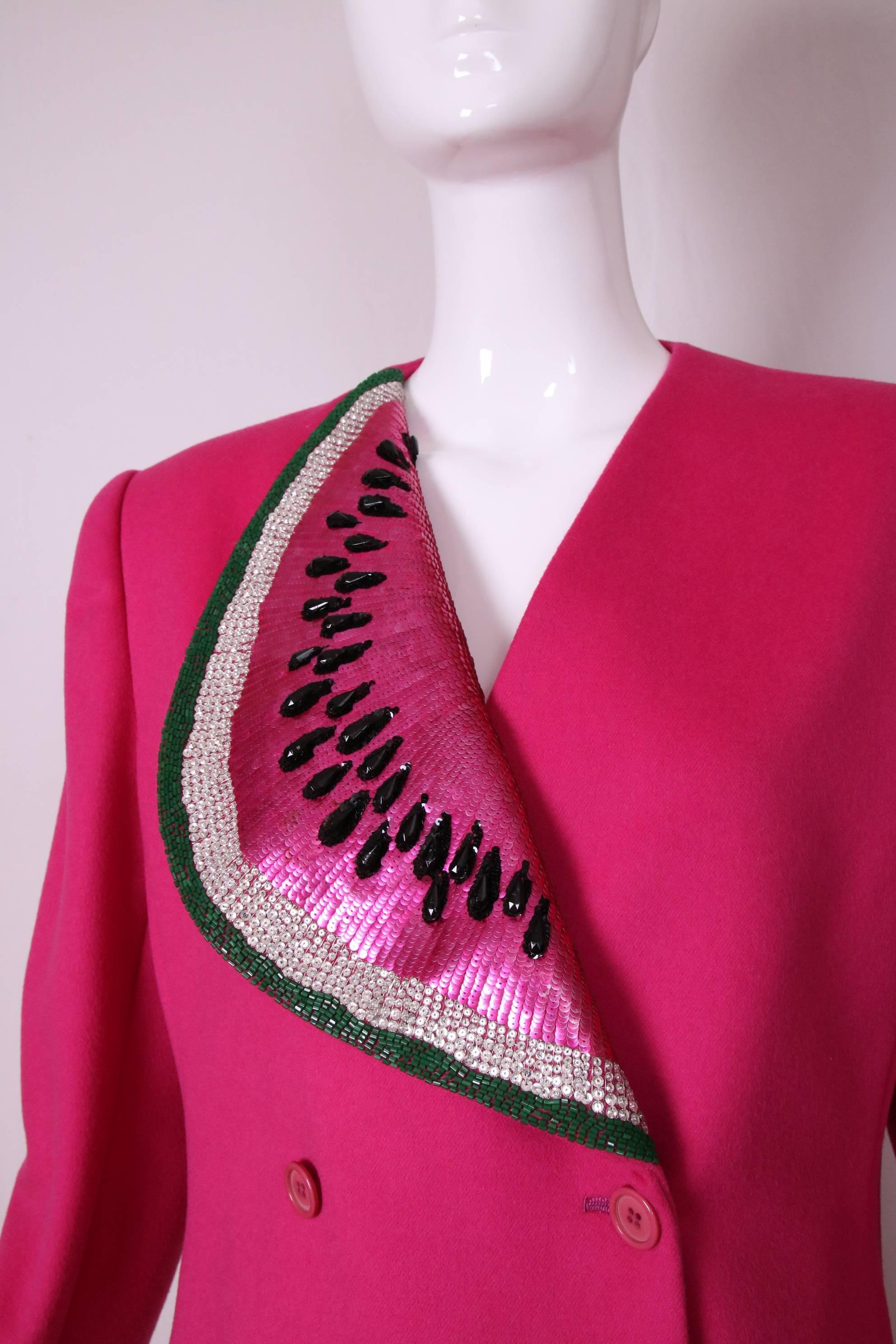 This 1983 Bill Blass shocking pink double breasted jacket with beaded and sequined watermelon at the lapel is considered iconic for Blass collectors and there is even one in the Met's permanent collection. In excellent condition. Size tag