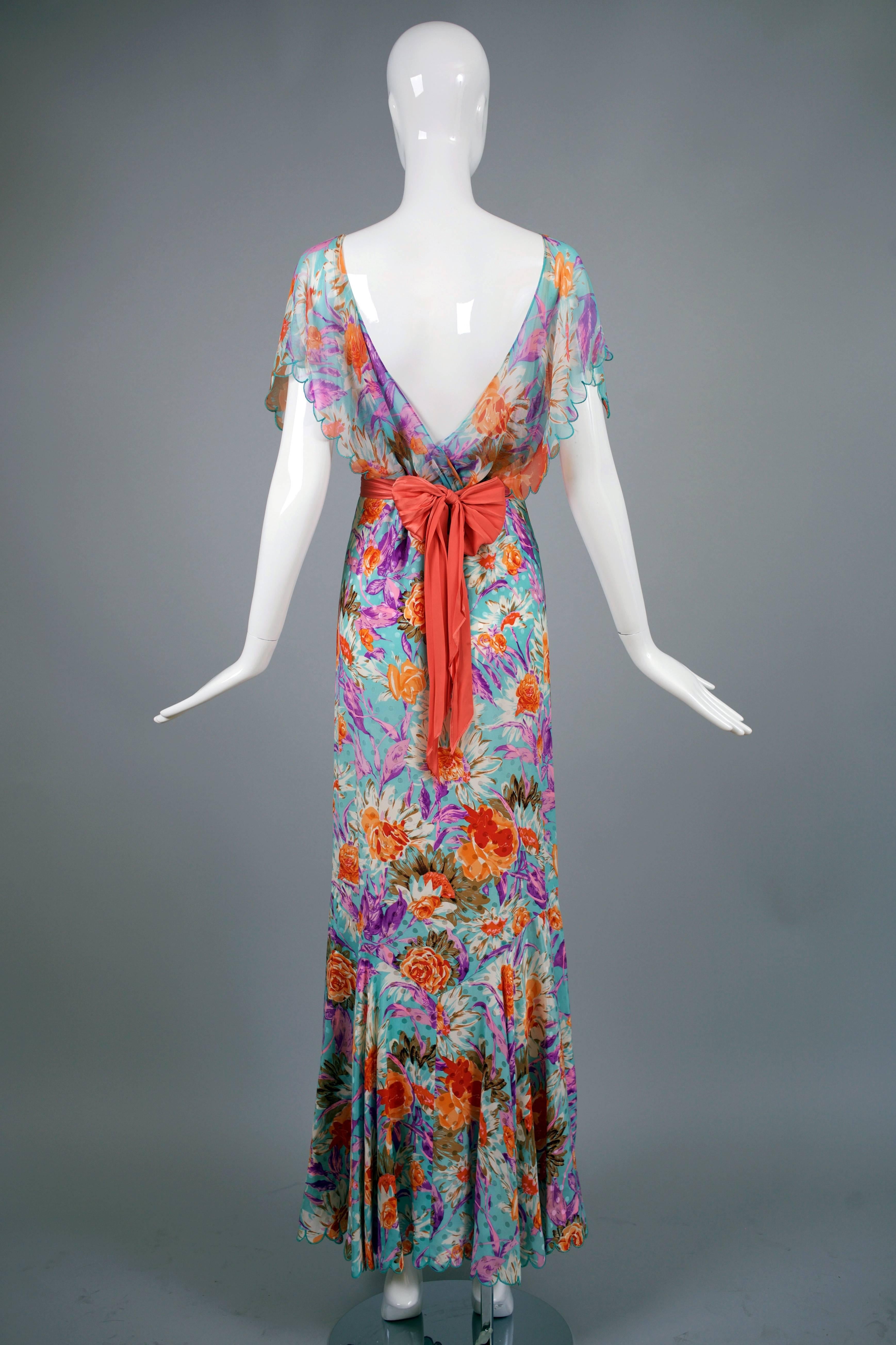 Ca. 2005 Tracy Feith 100% silk floral print bias cut 1930's-inspired evening gown with scalloped edge chiffon flounce sleeves, an open V-back and mermaid hem with scalloped edges. Comes with detachable pink pleated silk sash with diamond-shaped