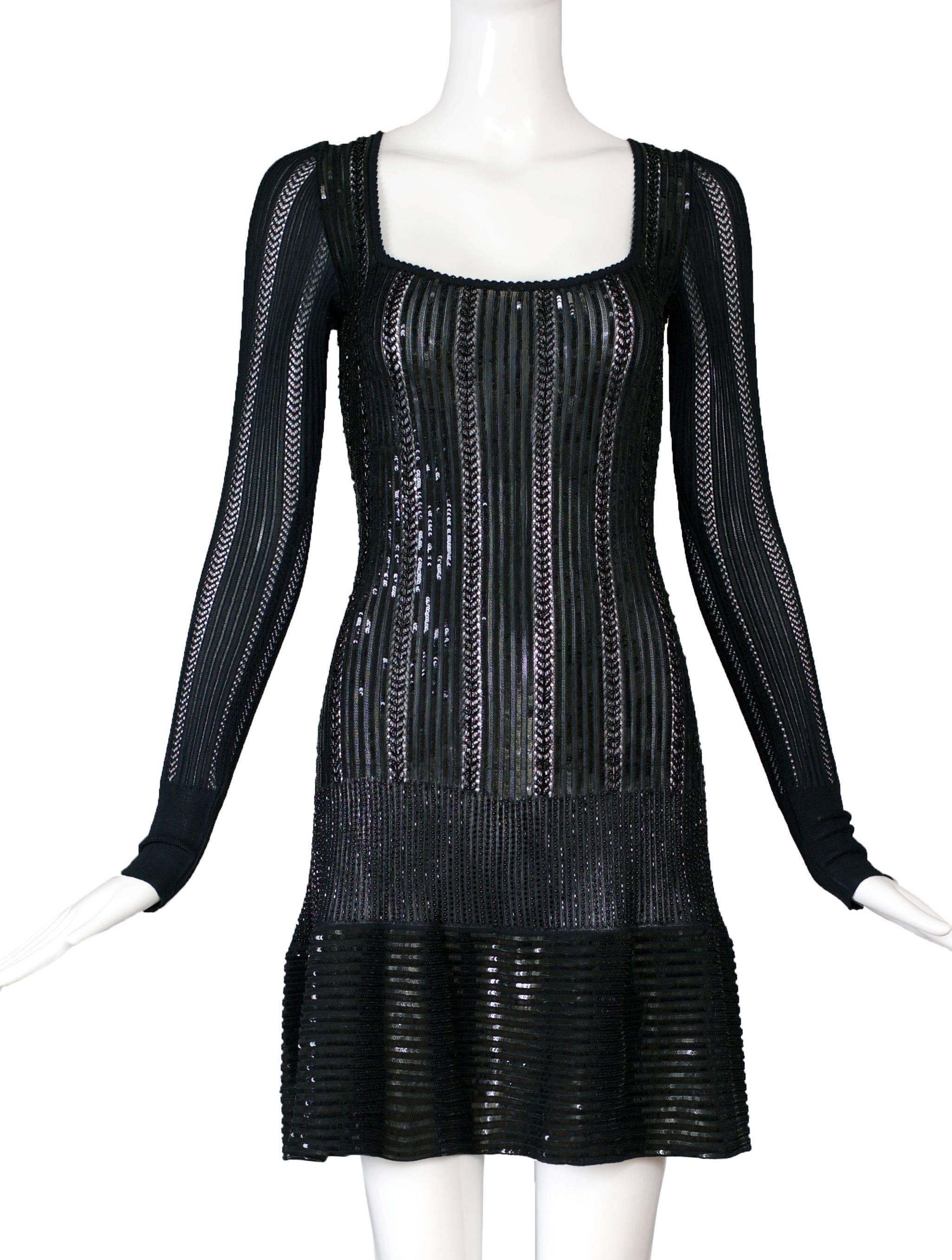 Stunning, rare Azzedine Alaia black hand-beaded and sequined bodycon knit viscose cocktail dress with long sleeves and scooped neck. Size tag small. In excellent condition. 
MEASUREMENTS:
Bust - (approx.) 32