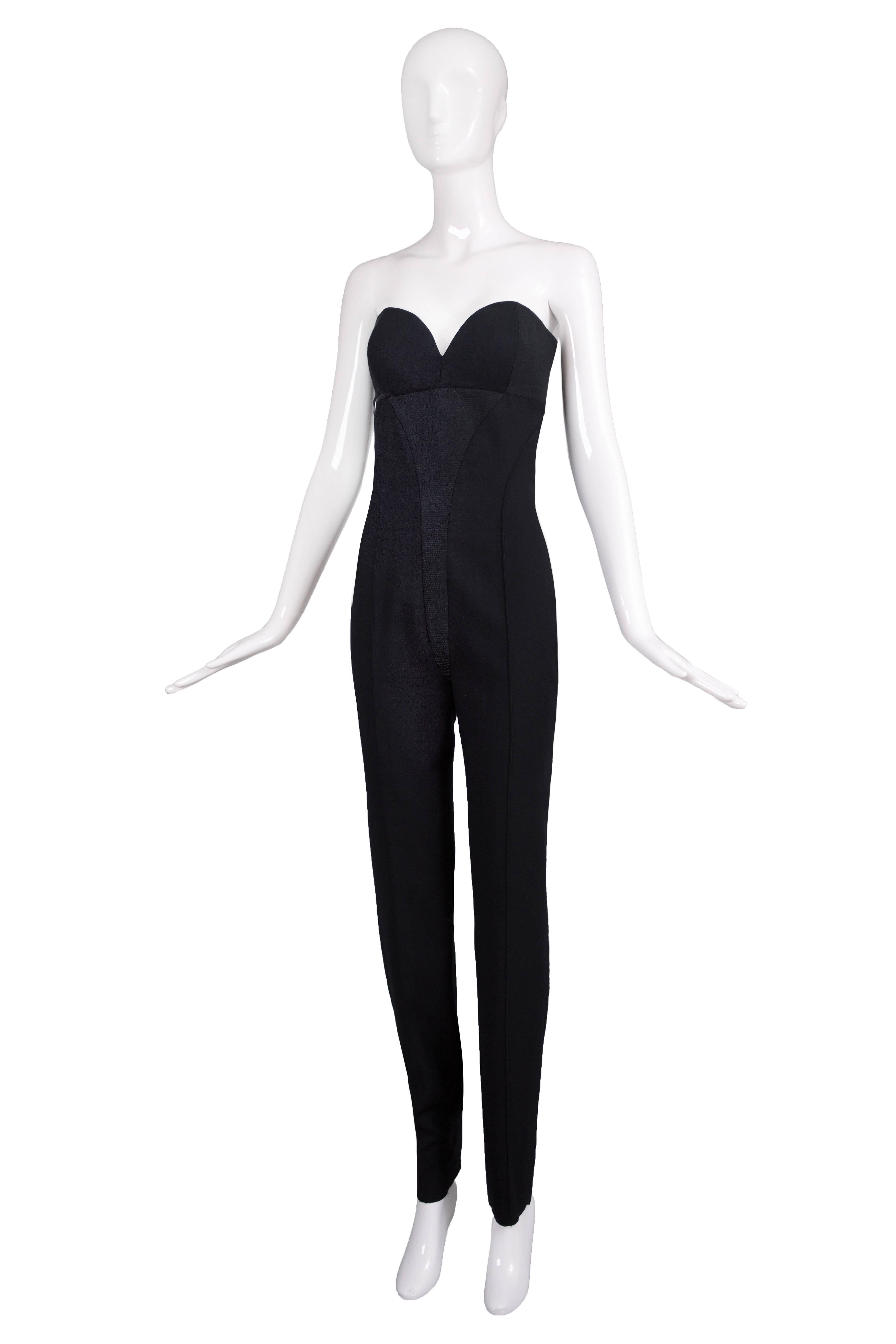 Versace Couture black wool jumpsuit with bustier top and overstitched inserts at center front and bustier sides. In excellent condition. Please consult measurements. Size tag 42.
MEASUREMENTS:
Bust - 36
Waist - 28