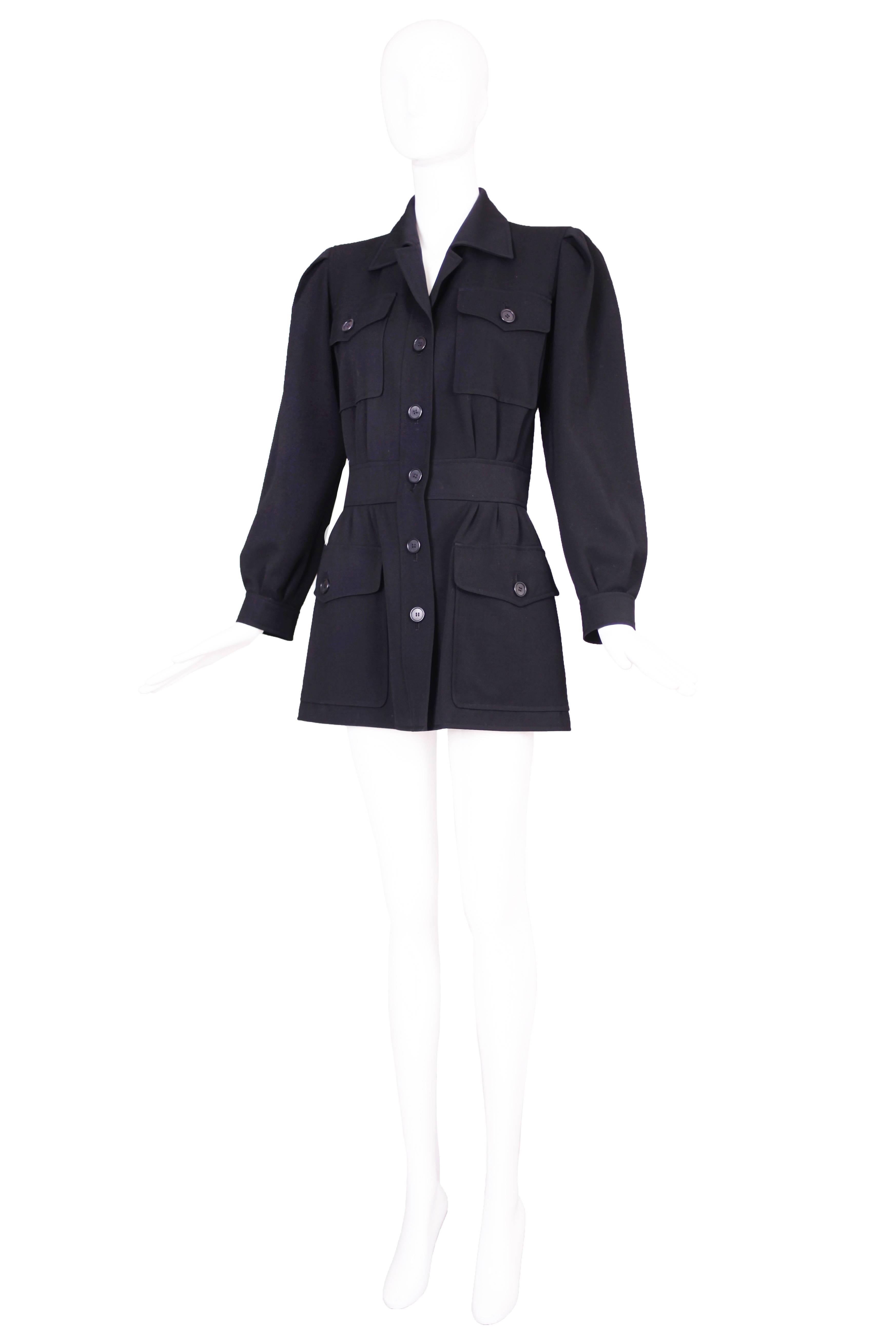 Iconic Yves Saint Laurent safari style deep navy blue gabardine jacket. In excellent condition. Size 38.
MEASUREMENTS