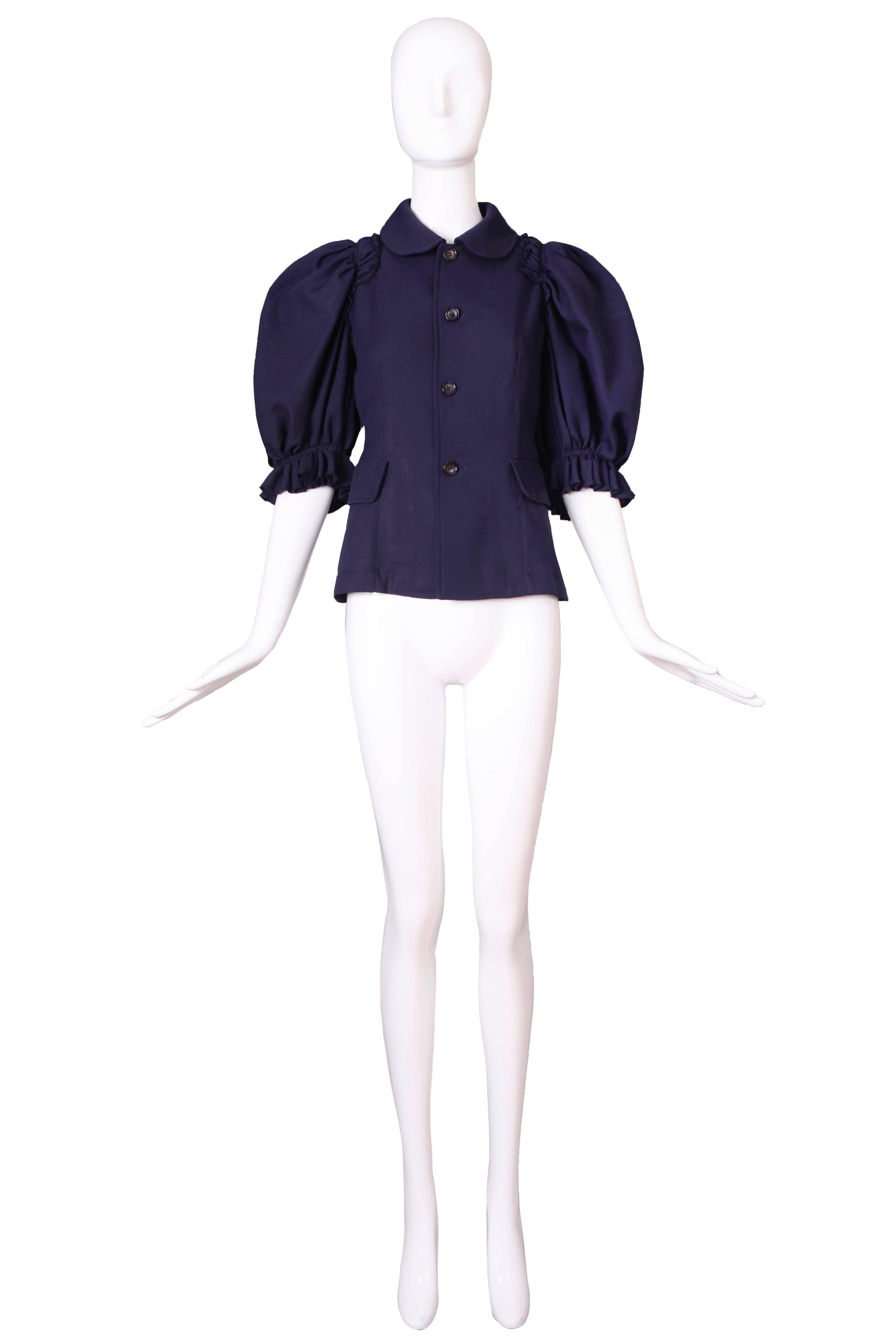 2007 Comme des Garcons deep navy blue top with oversize sleeves and buttons up the front. Size Small. In excellent condition.
MEASUREMENTS:
Bust - 35