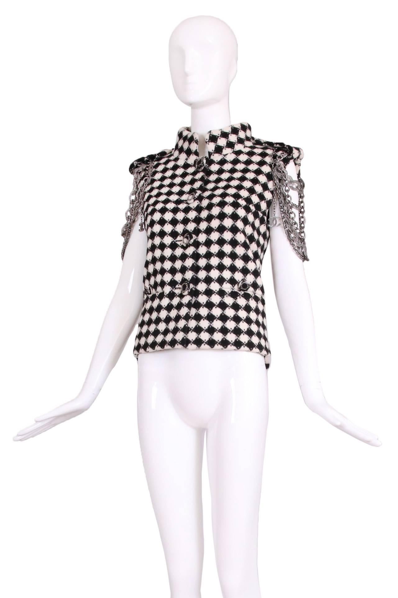 2011 A/H Chanel post-apocalyptic collection black and white diamond print wool vest with shoulder lapels, oversized chain-decorated buttons and loose oversized curb-link chain at the shoulders. Fully lined in silk. In excellent condition. No size
