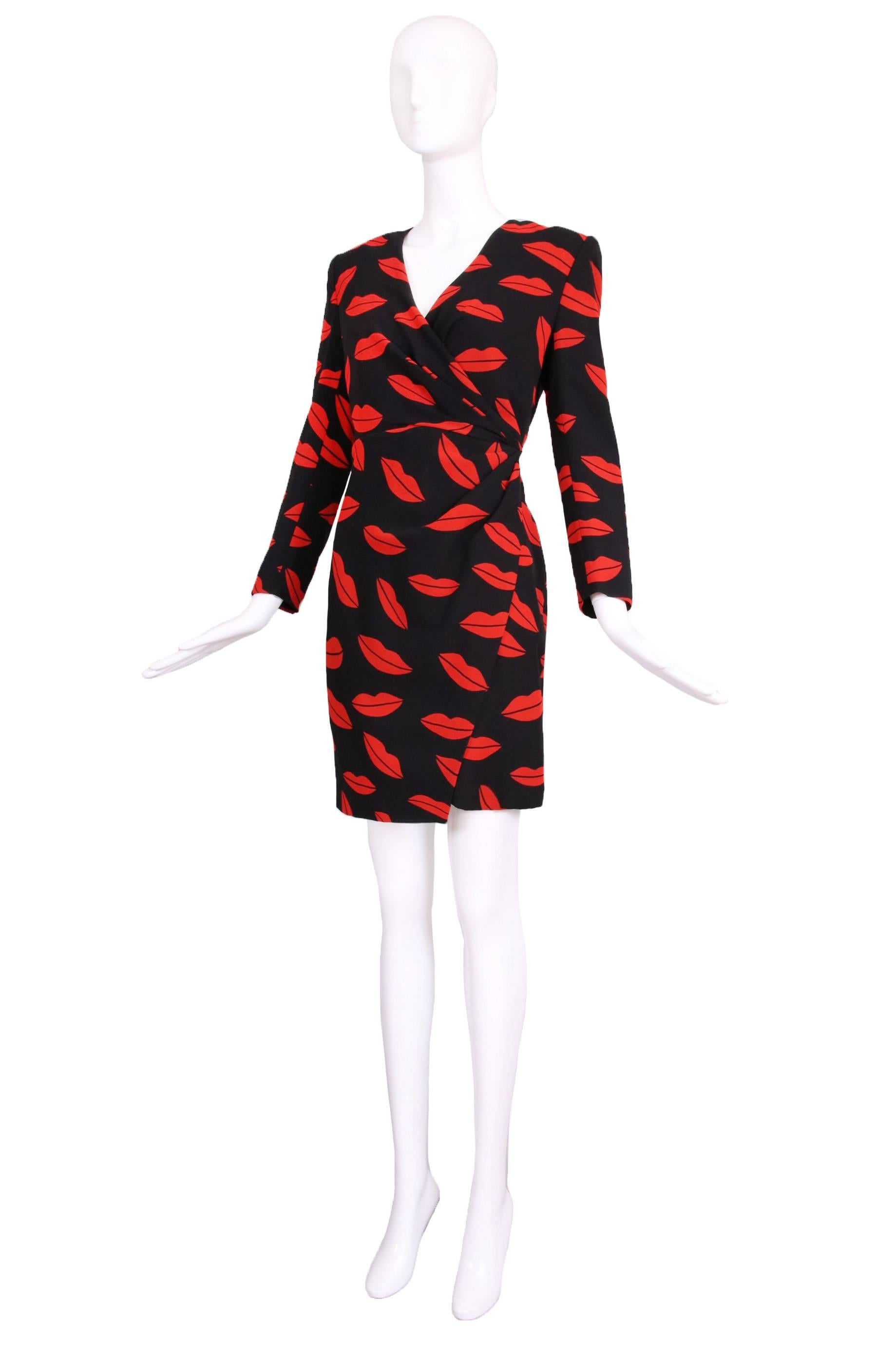 2013 Saint Laurent silk black with red lips print faux wrap dress. Dress is new with tags still attached. Size 40. In excellent condition with one near invisible pull at the left shoulder.
MEASUREMENTS:
Bust - 36