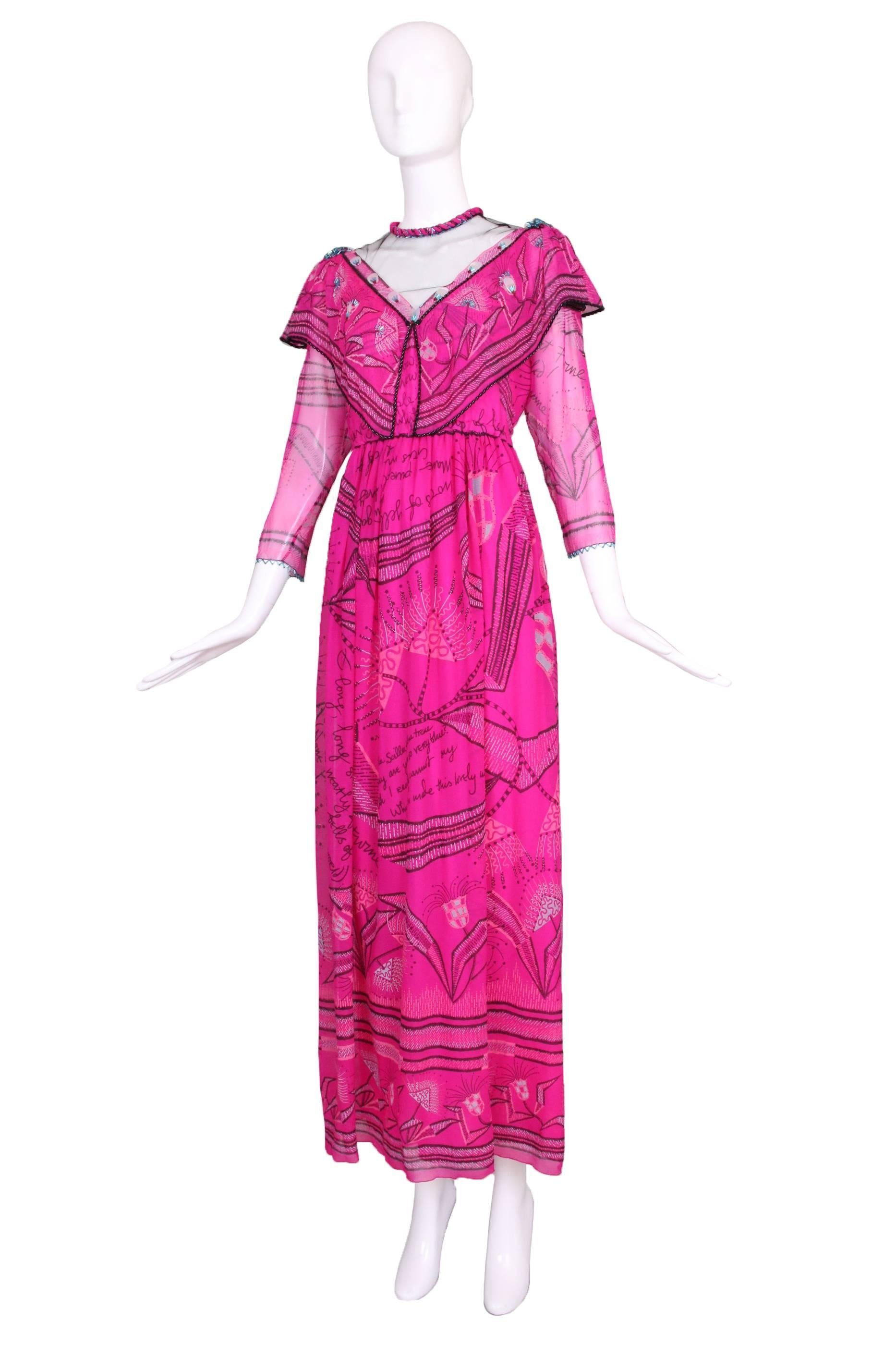 Zandra Rhodes fuchsia silk chiffon dress printed with the words of a poem as well as an abstract floral pattern. Beaded trim throughout, elastic waist. Braided trim at neck ties as the neck back. In excellent condition. Tag size