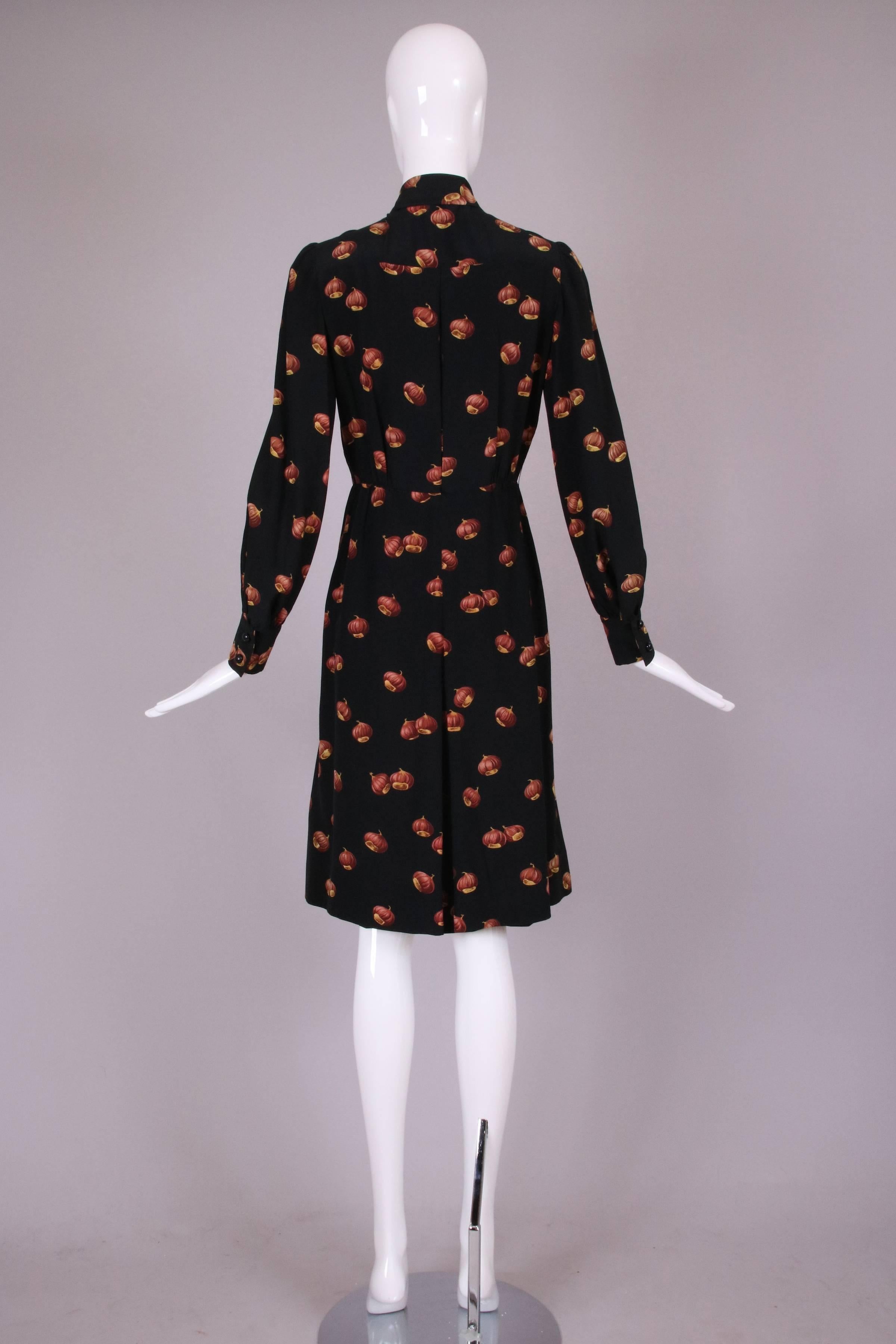 1970's Valentino silk day dress with chestnut print throughout. This dress has a box pleat button placket down center front and two inverted pleats on the skirt. A classic secretary dress. 

Measurements:
Bust - 38"   
Waist -