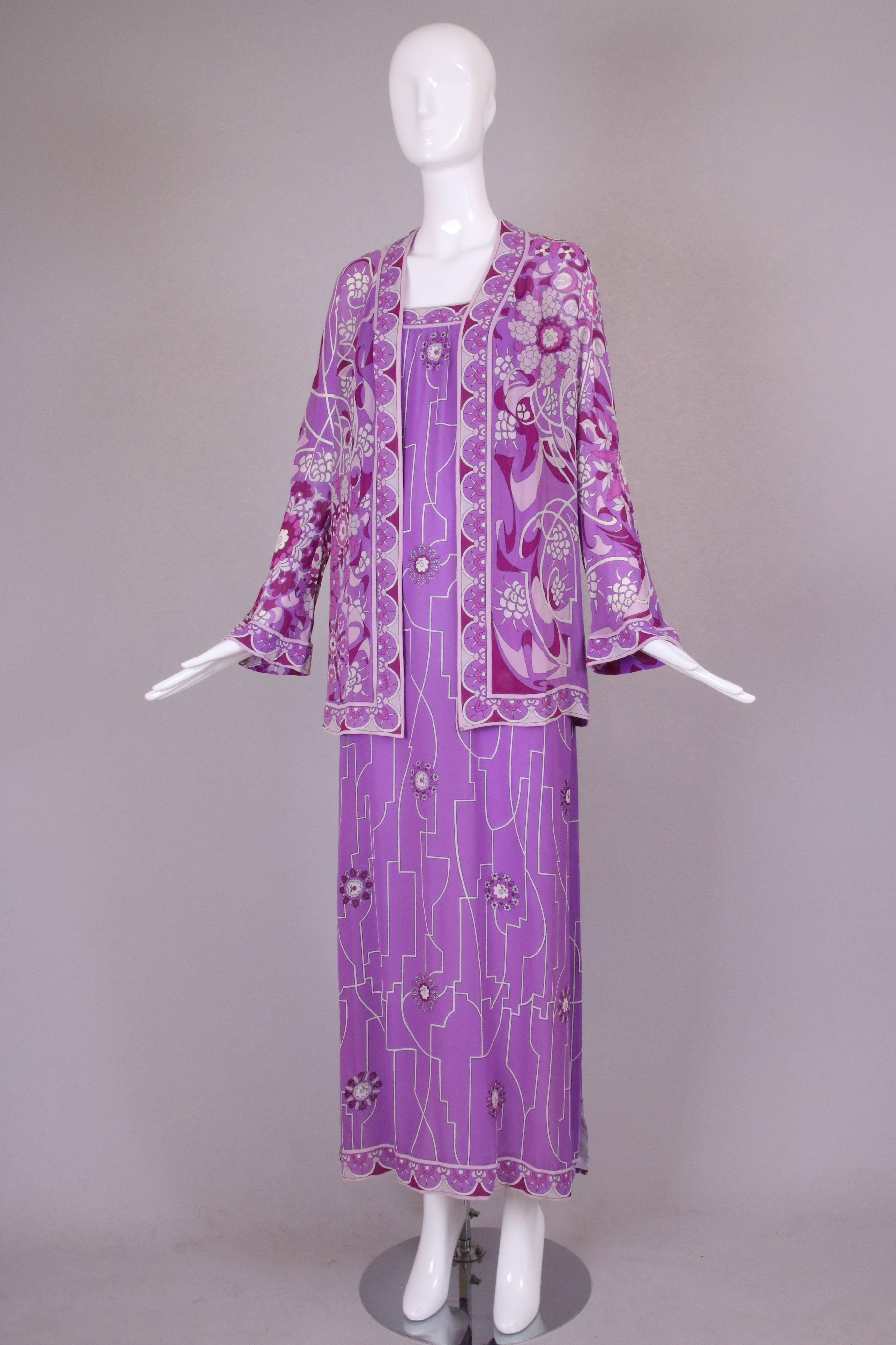 1970's Pucci maxi dress in deep purple, purple, lavender and white silk chiffon with spaghetti straps. This dress has lavender chiffon attached slip. In very good to excellent condition with some very light color fading to the dress at the bottom