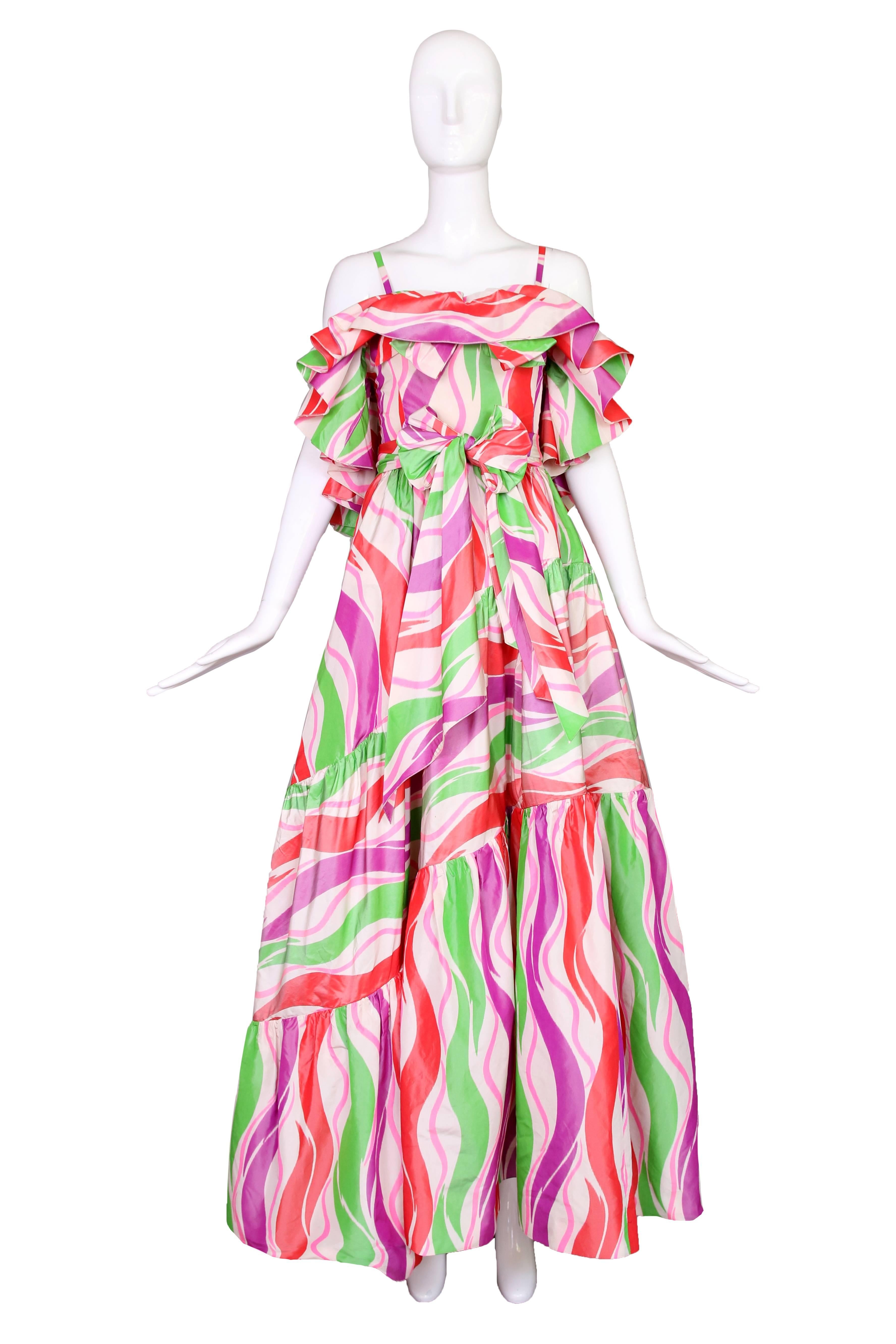 Circa 1979 beyond gorgeous Yves Saint Laurent haute couture silk taffeta green, purple, pink and red abstract print evening gown with detachable sash. In excellent condition.
MEASUREMENTS:
Bust - 30