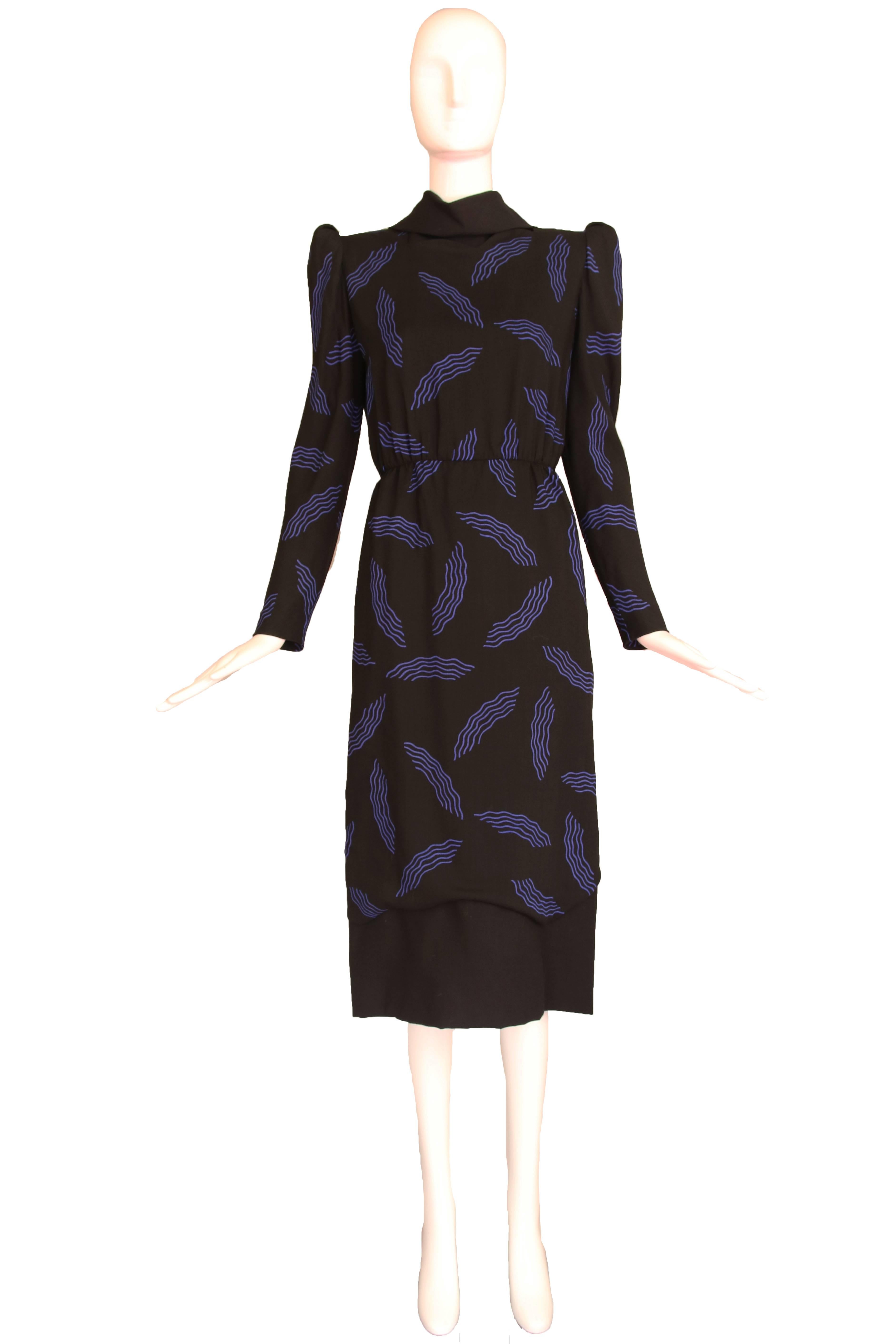 1980's Carolina Herrera black wool dress w/blue squiggle print and architectural design elements. Size 6. In excellent condition.
MEASUREMENTS:
Bust - 36