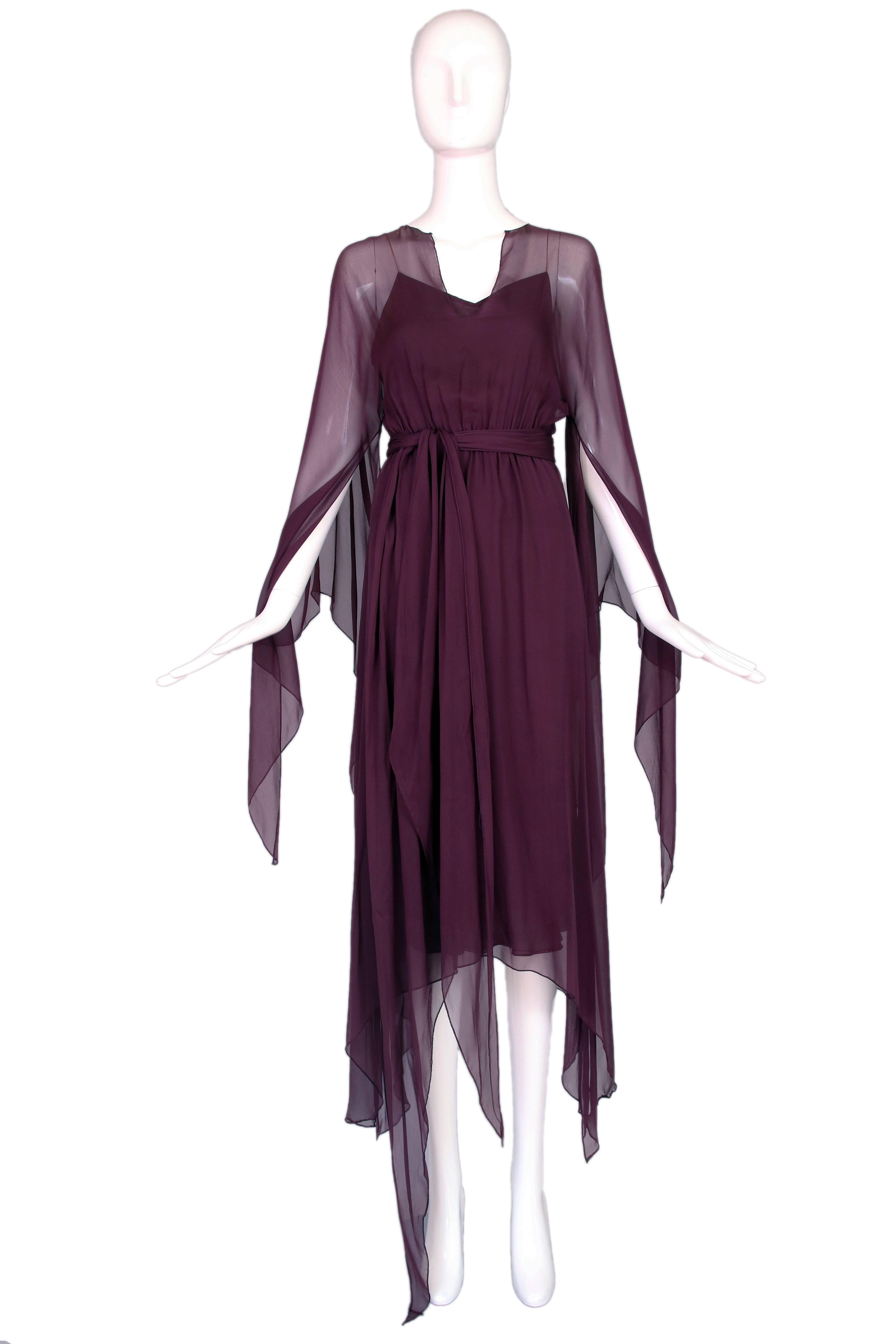 1970's Halston eggplant/purple double layer chiffon dress with sash tie and mult-layered matching slip. In excellent condition.
MEASUREMENTS:
Bust - 32