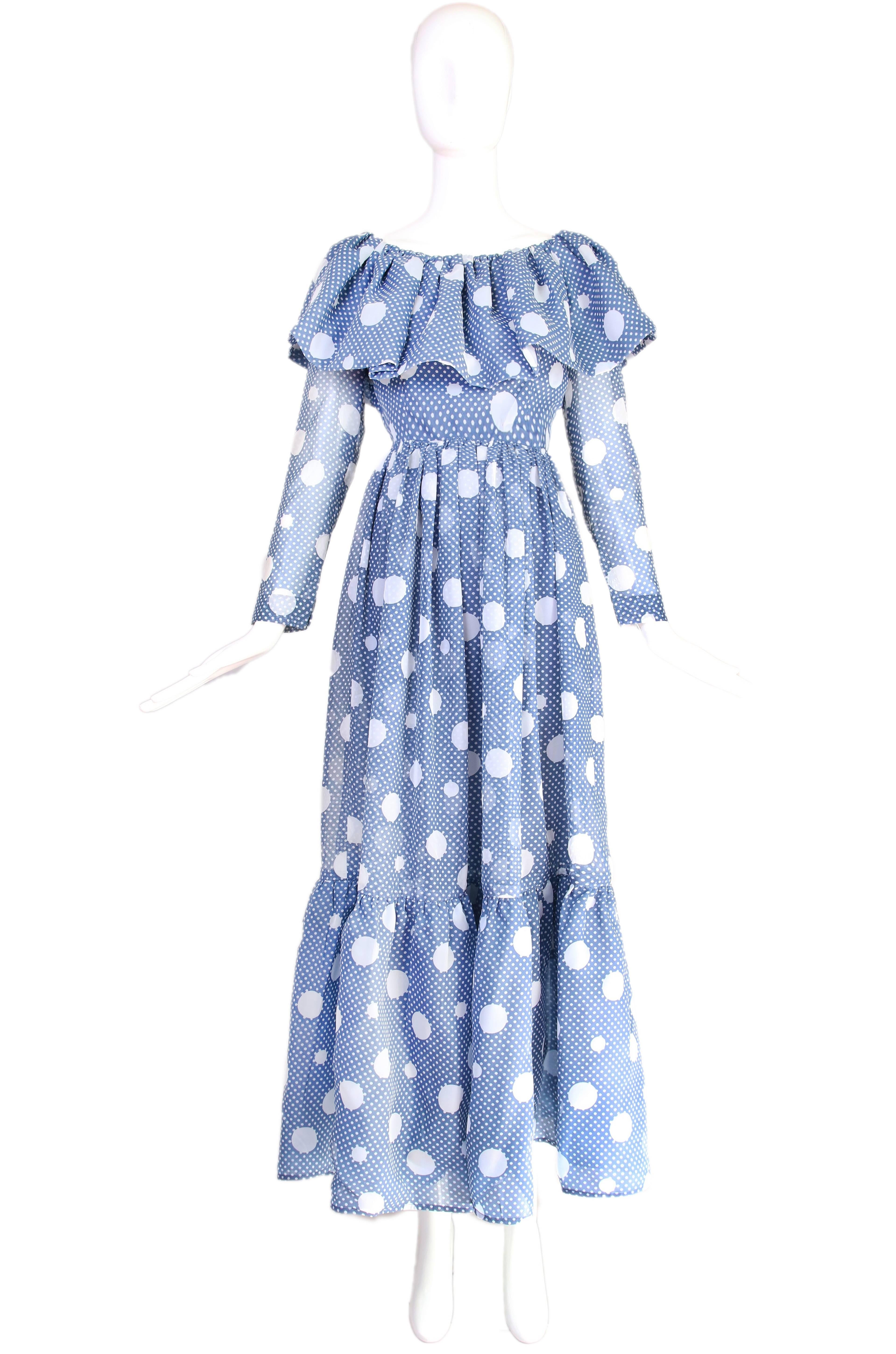 1960's Geoffrey Beene blue & white polka dot tiered maxi dress with oversized ruffled boat neck collar. In excellent condition. No size tag so please consult measurements.
MEASUREMENTS:
Bust - 36"
Waist - 28"
Shoulders - 14