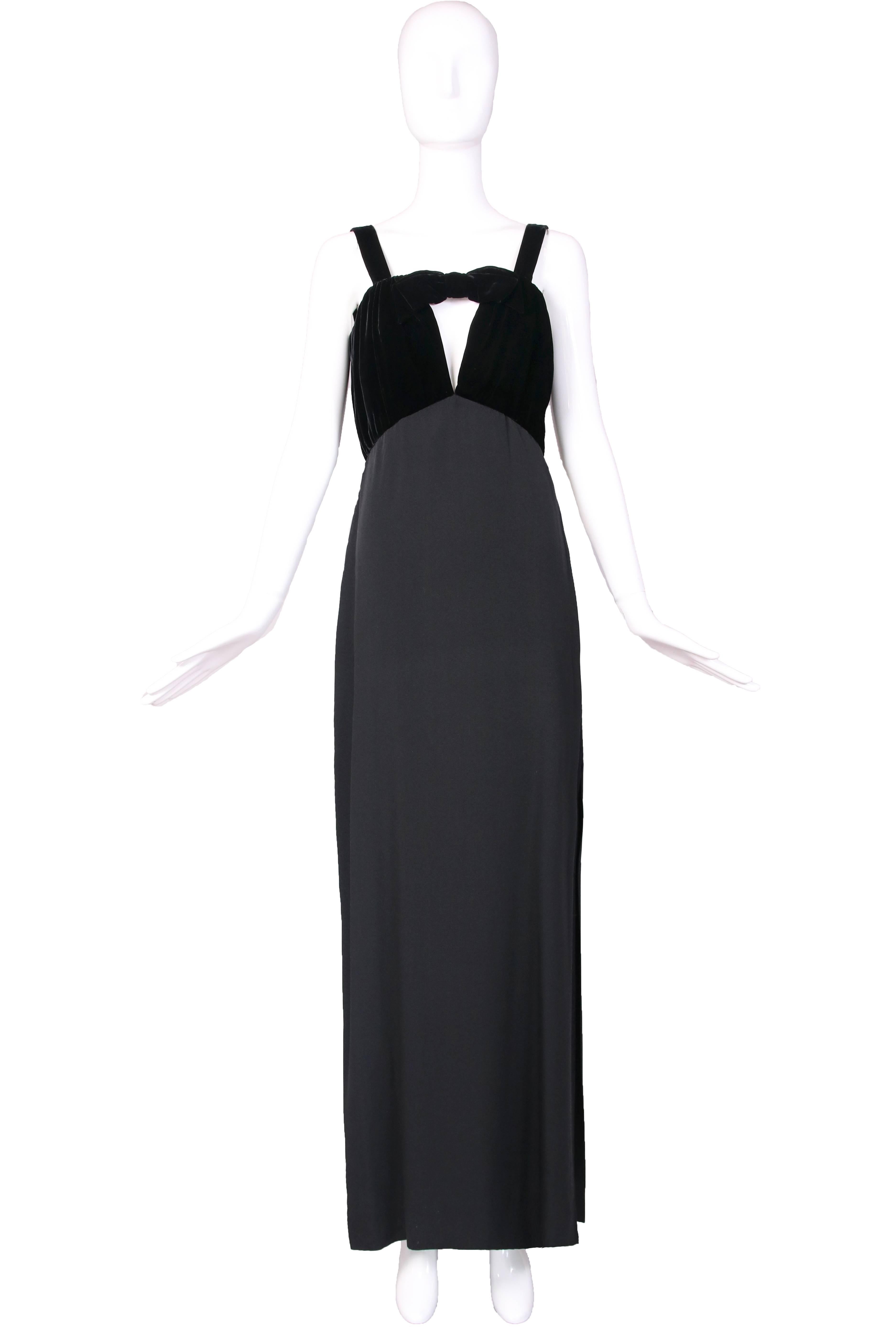 1989 Yves Saint Laurent black silk evening gown with velvet bodice and keyhole v-neckline featuring a velvet bow. Dramatic side slit at bottom left of skirt. In excellent condition. Size 40.
MEASUREMENTS:
Bust - 34