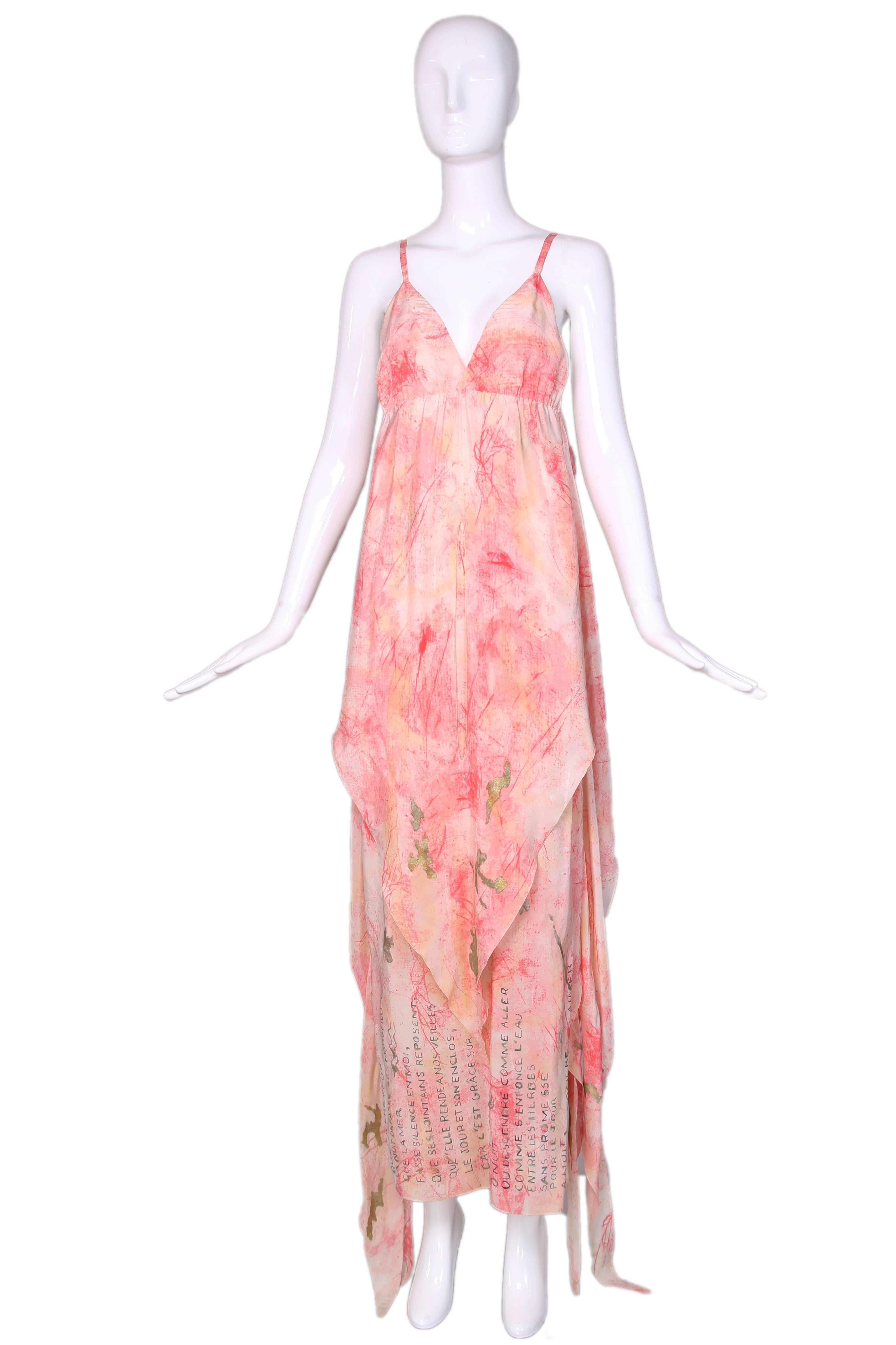 Vintage Chloe orange-pink silk spagetti strap maxi dress w/layers that can be worn multiple ways. Hand-painted gold writing at bottom in French. In excellent condition. Size EU 38.
MEASUREMENTS:
Bust - 32