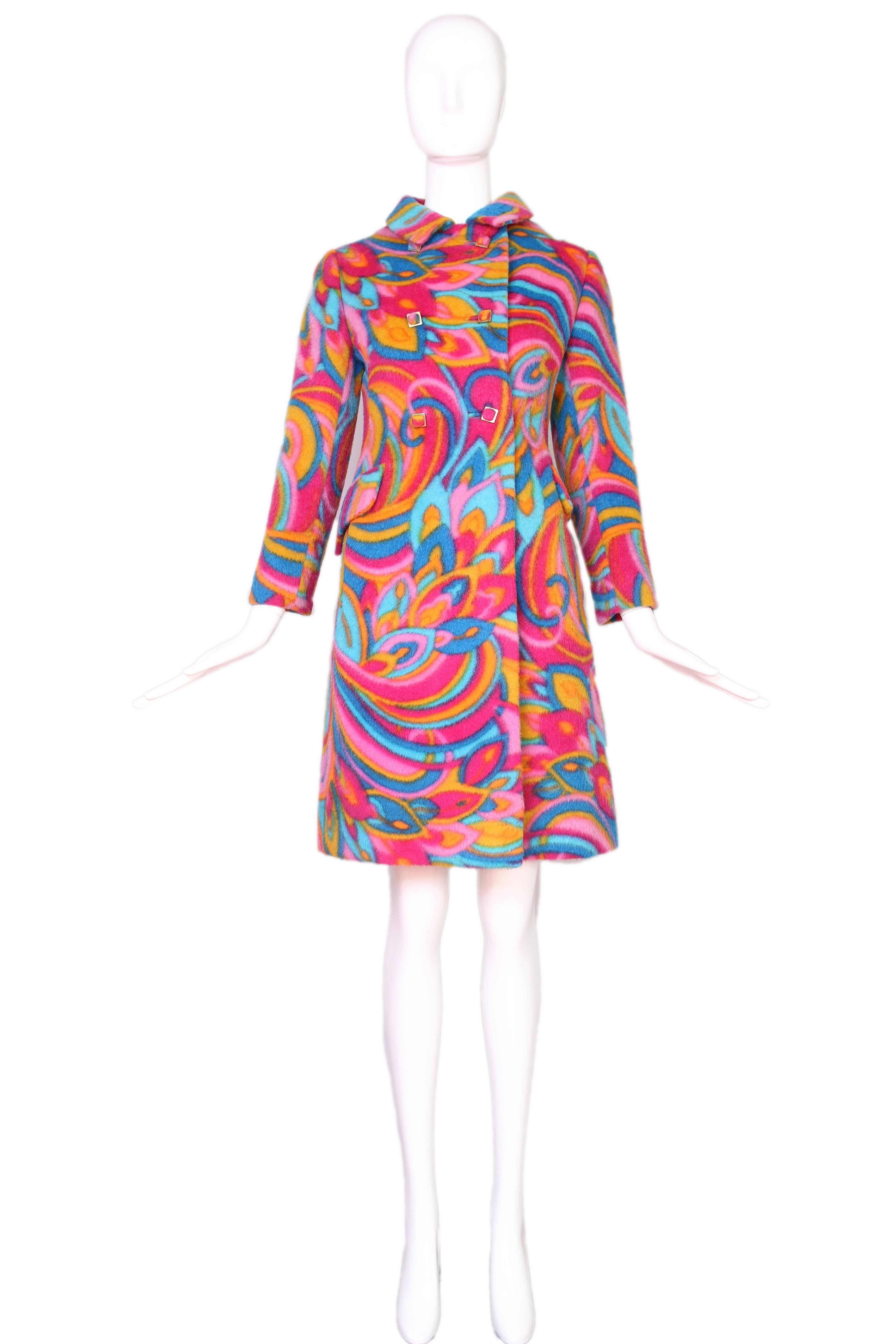 1960's Bill Blass for Maurice Rentner psychedelic wool coat with matching square buttons. In excellent condition with some wear to the collar that looks like it could be part of the fabric print. Size 6 but please consult measurements.