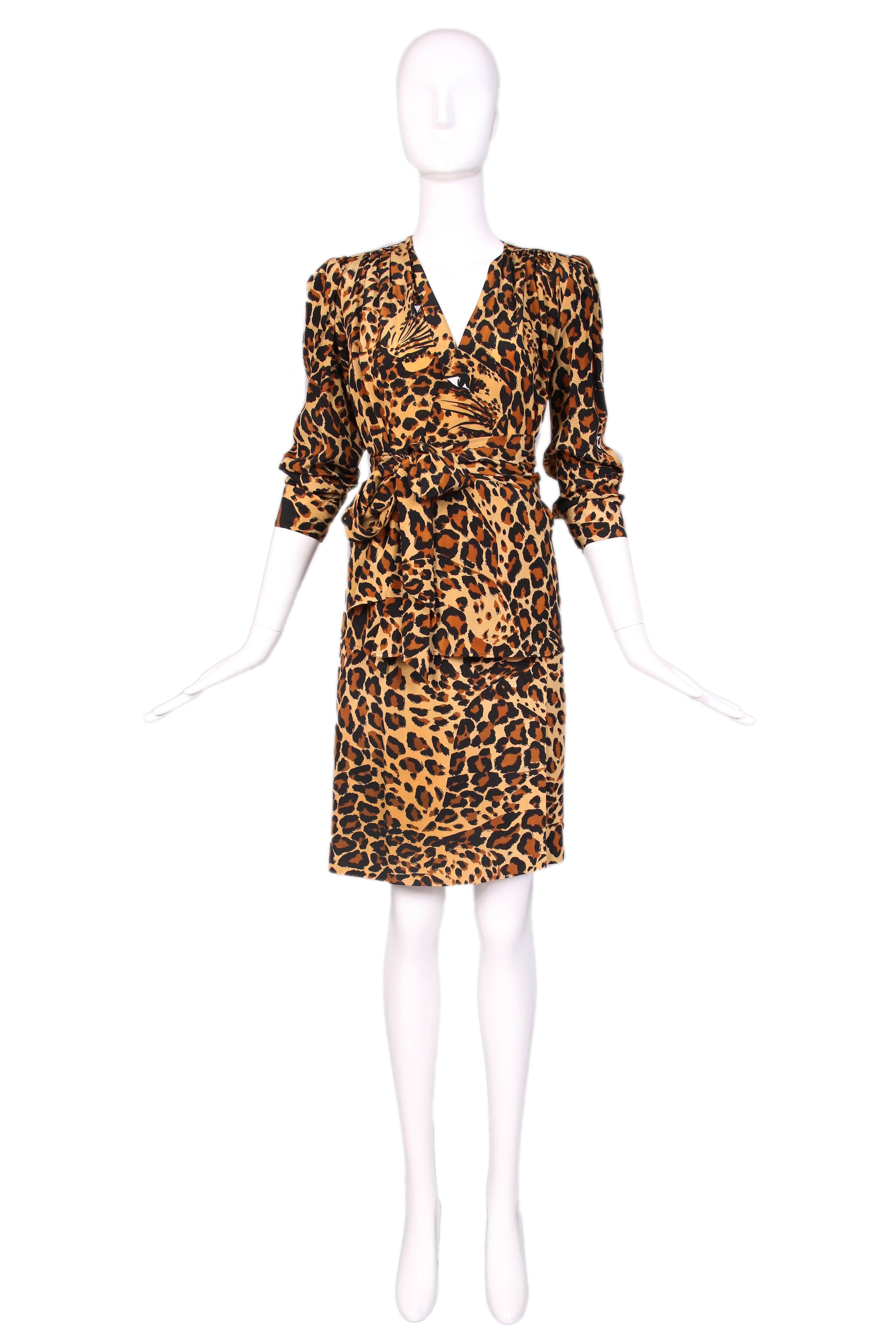 Yves Saint Laurent silk leopard print silk ensemble w/ wrap blouse and skirt, and matching sash. In excellent condition. Size EU 38
MEASUREMENTS:
Blouse:
Bust - 36