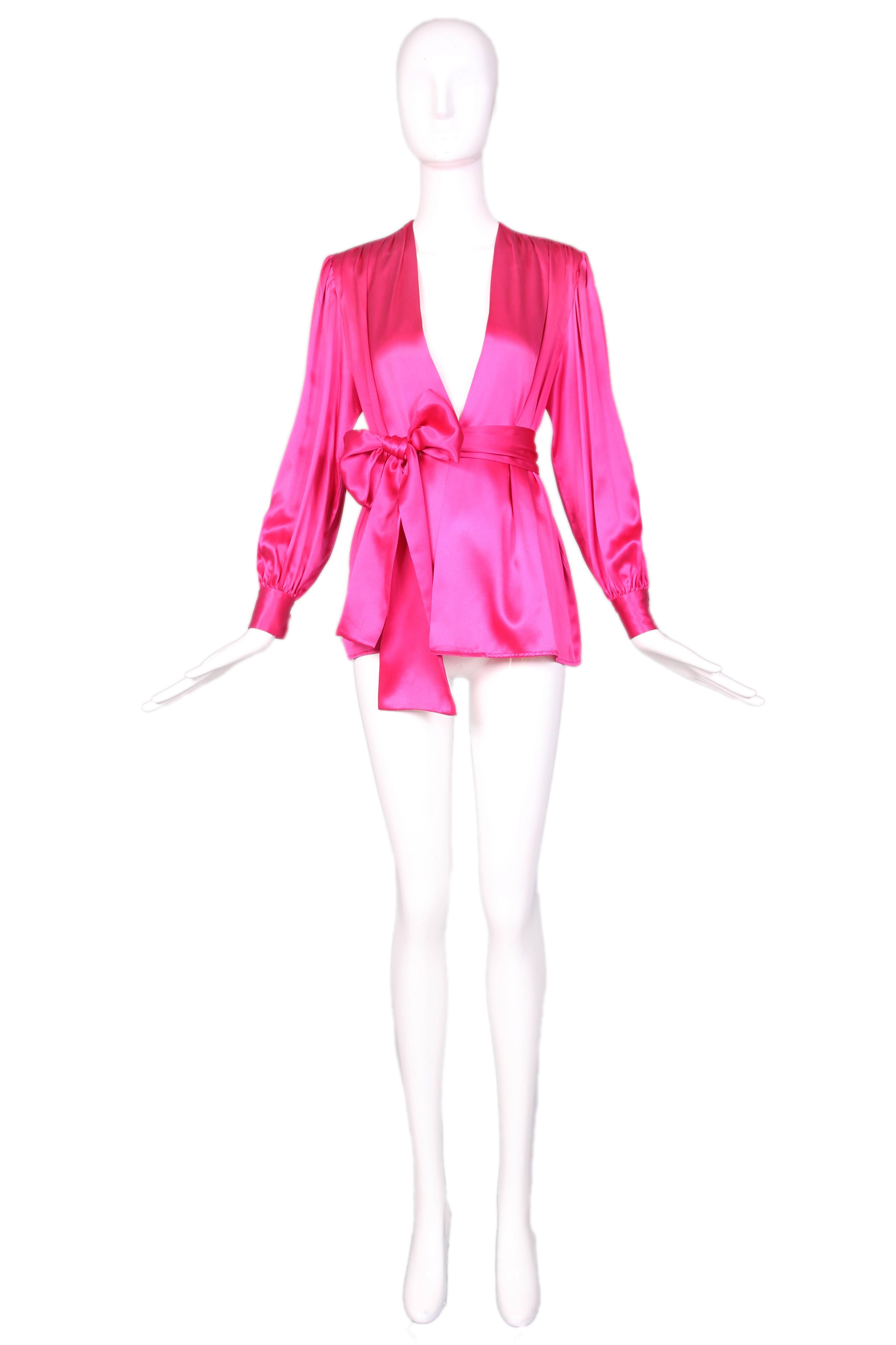 Yves Saint Laurent hot pink silk blouse top w/matching sash. In excellent condition. Size EU 44. 
MEASUREMENTS:
Bust - 40