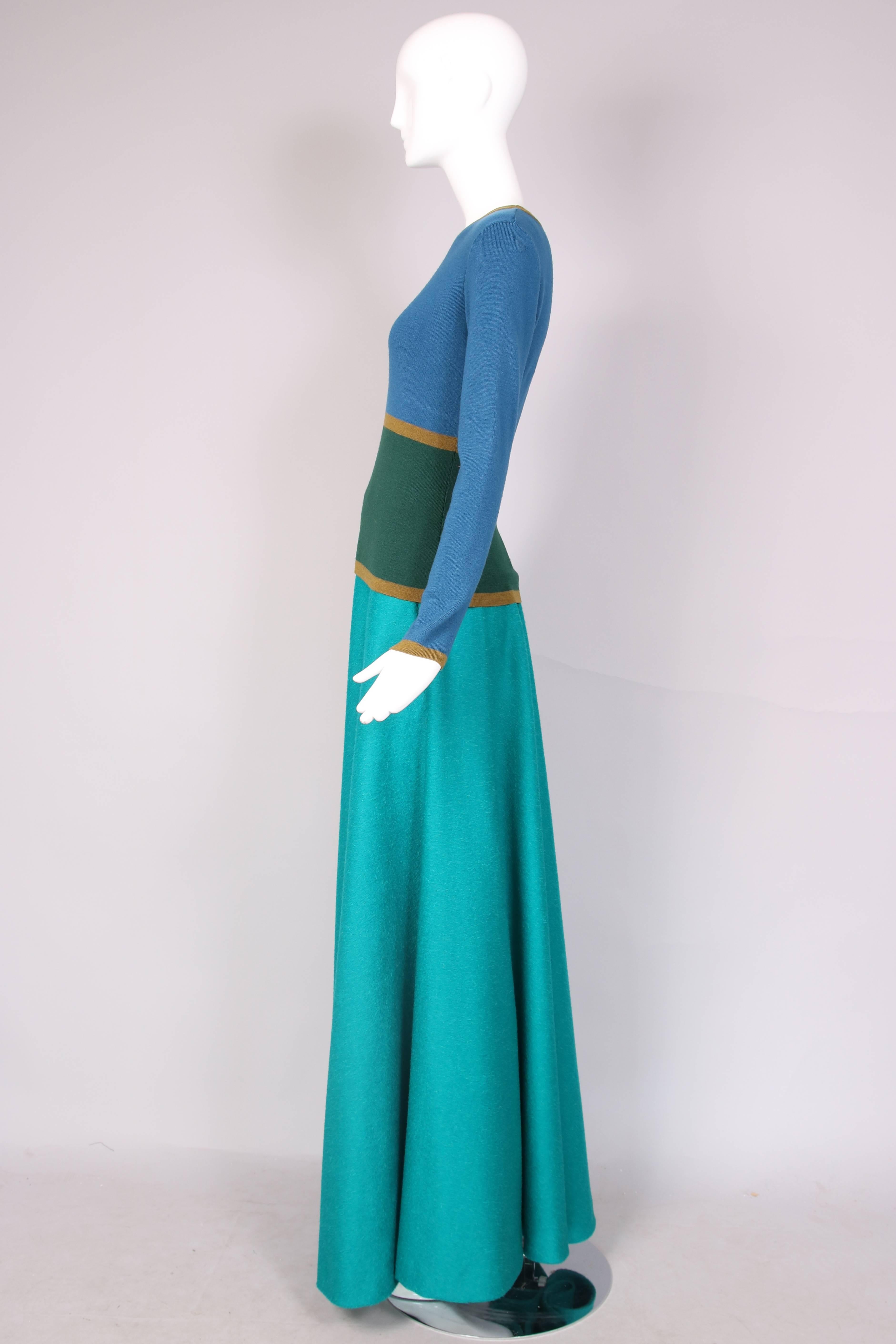 Yves Saint Laurent green & blue long sleeve lambswool sweater and teal blue alpaca wool full maxi skirt ensemble. In excellent condition. Sweater is a size 40, skirt is unlabeled.
MEASUREMENTS:
Sweater
Shoulders - 15