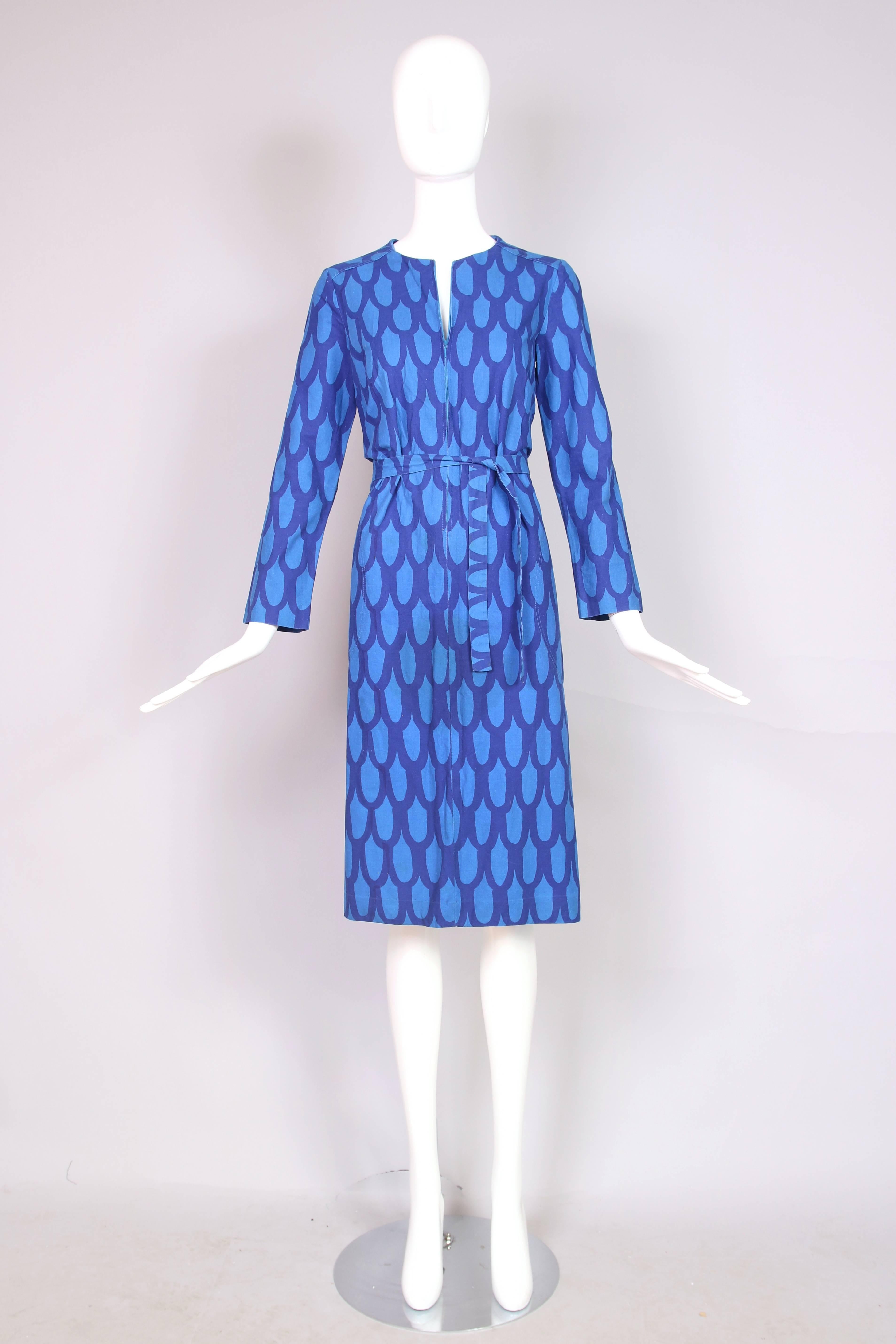 1970's Marimekko blue cotton long sleeved shift day dress with repeating geometric print, front zipper closure and self tie belt. In excellent condition. No size tag, please see measurements.
MEASUREMENTS:
Bust - 35