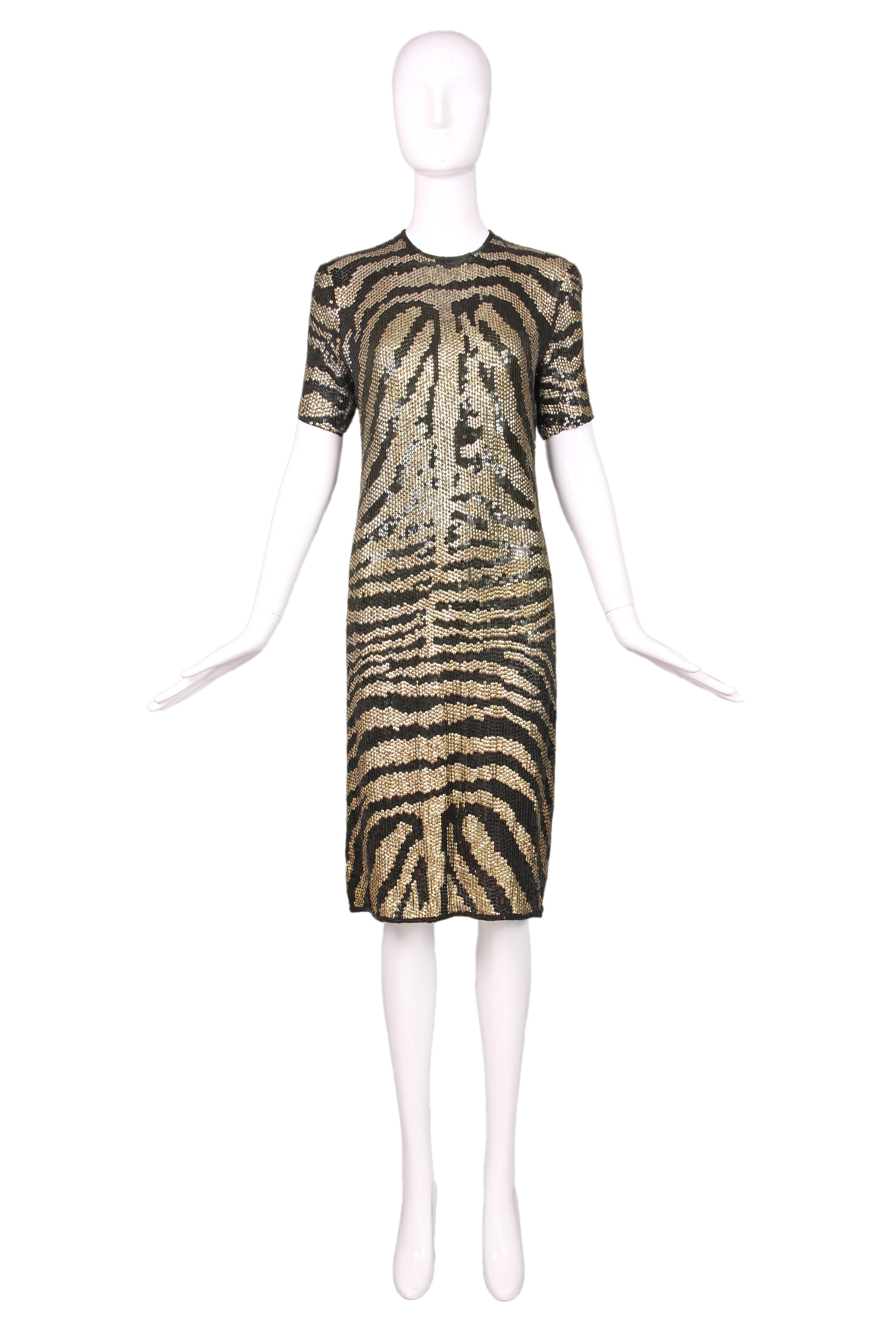 1970's Halston gold & black sequin short sleeved tiger print evening dress. In excellent condition. 
MEASUREMENTS:
Bust - 34