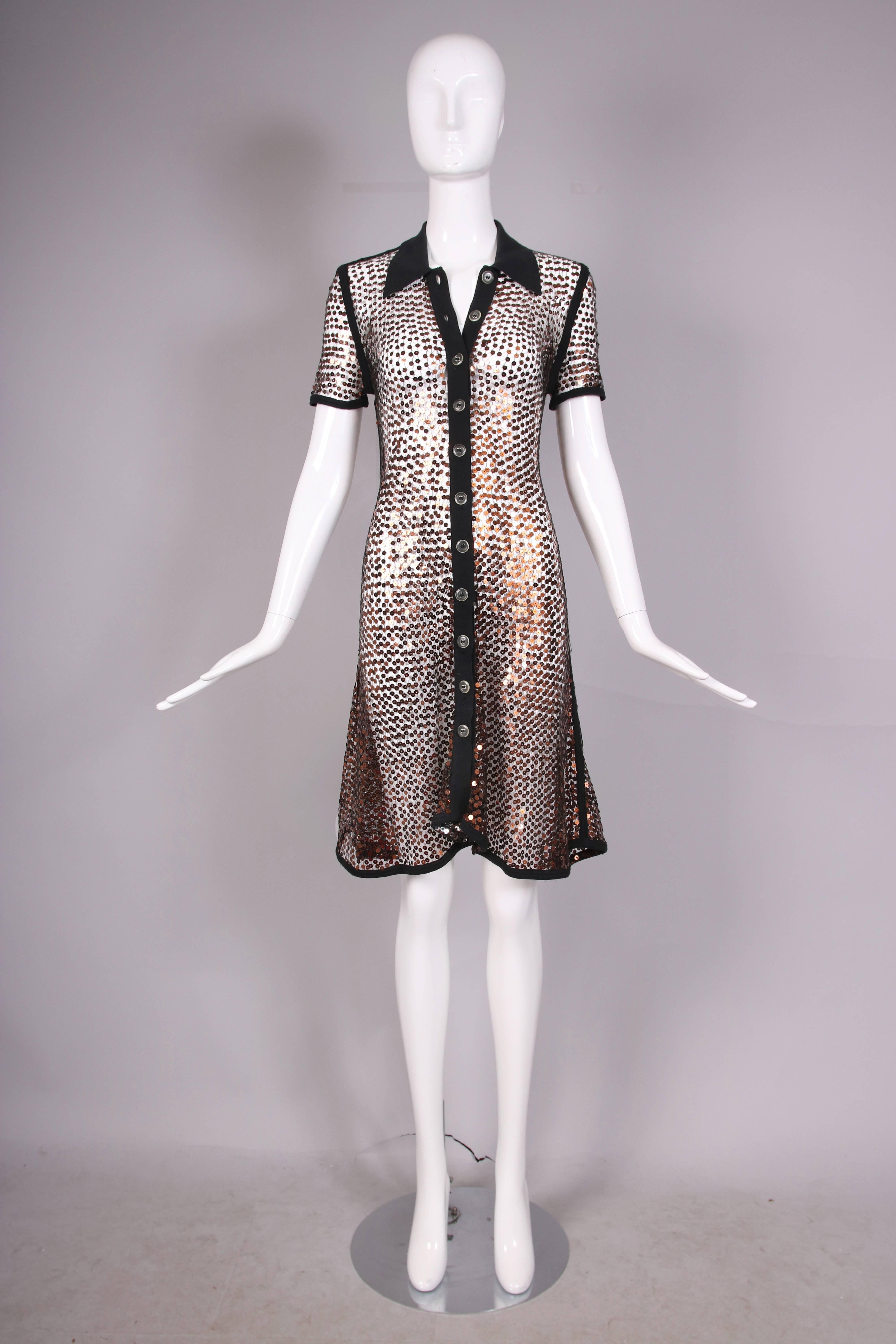 Jean-Paul Gaultier sheer sequined short-sleeved button up shirt dress with ribbed knit collar, button placket and seam insets. In excellent condition with a few missing sequins. 
MEASUREMENTS:
Bust - 34