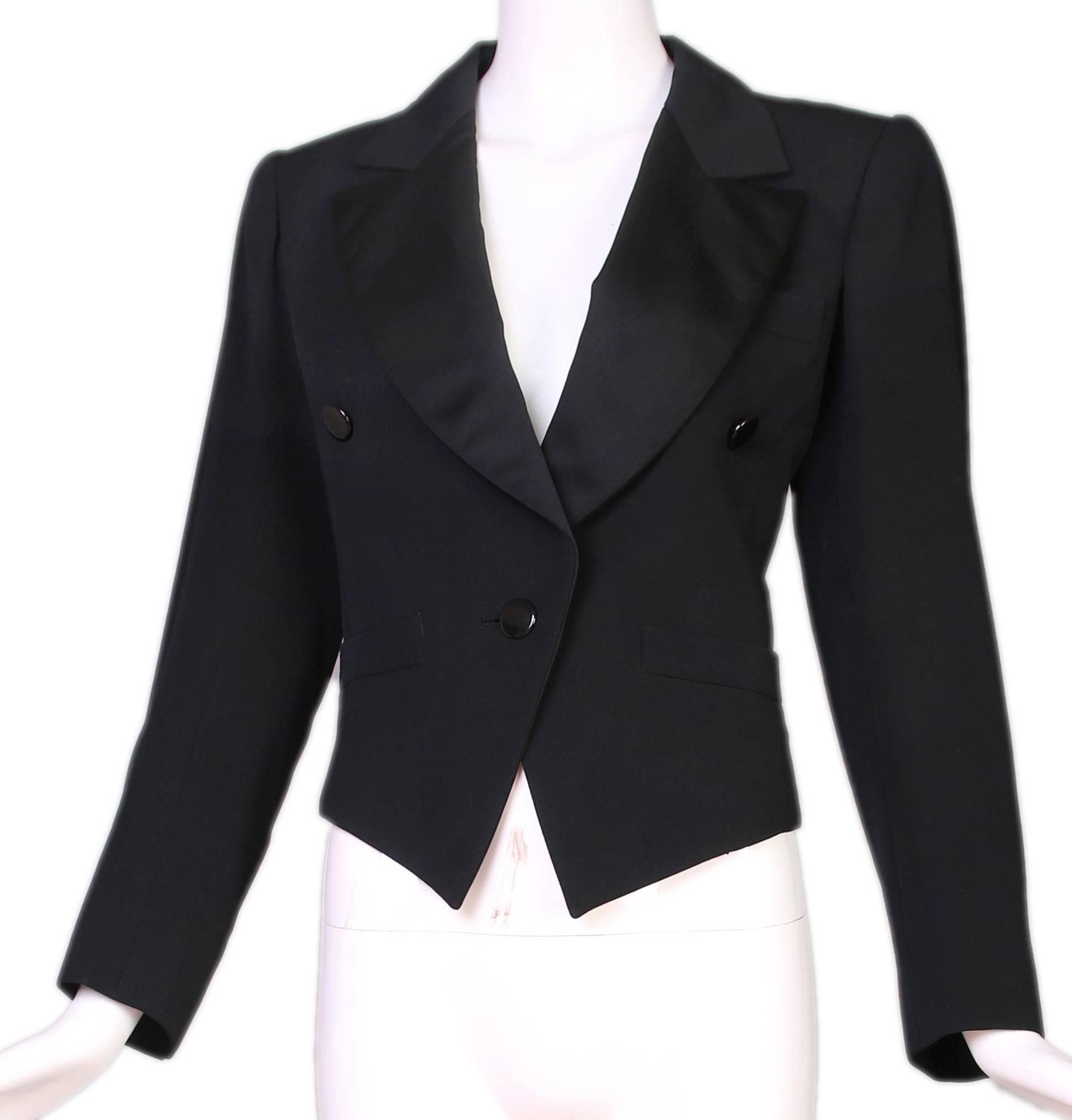 1970's Yves Saint Laurent YSL black lightweight wool cropped Le Smoking or tuxedo jacket with satin collar and lapel. In excellent condition, tag size 38. Silk YSL blouse and pants are sold separately.
MEASUREMENTS:
Bust - 36"
Waist -