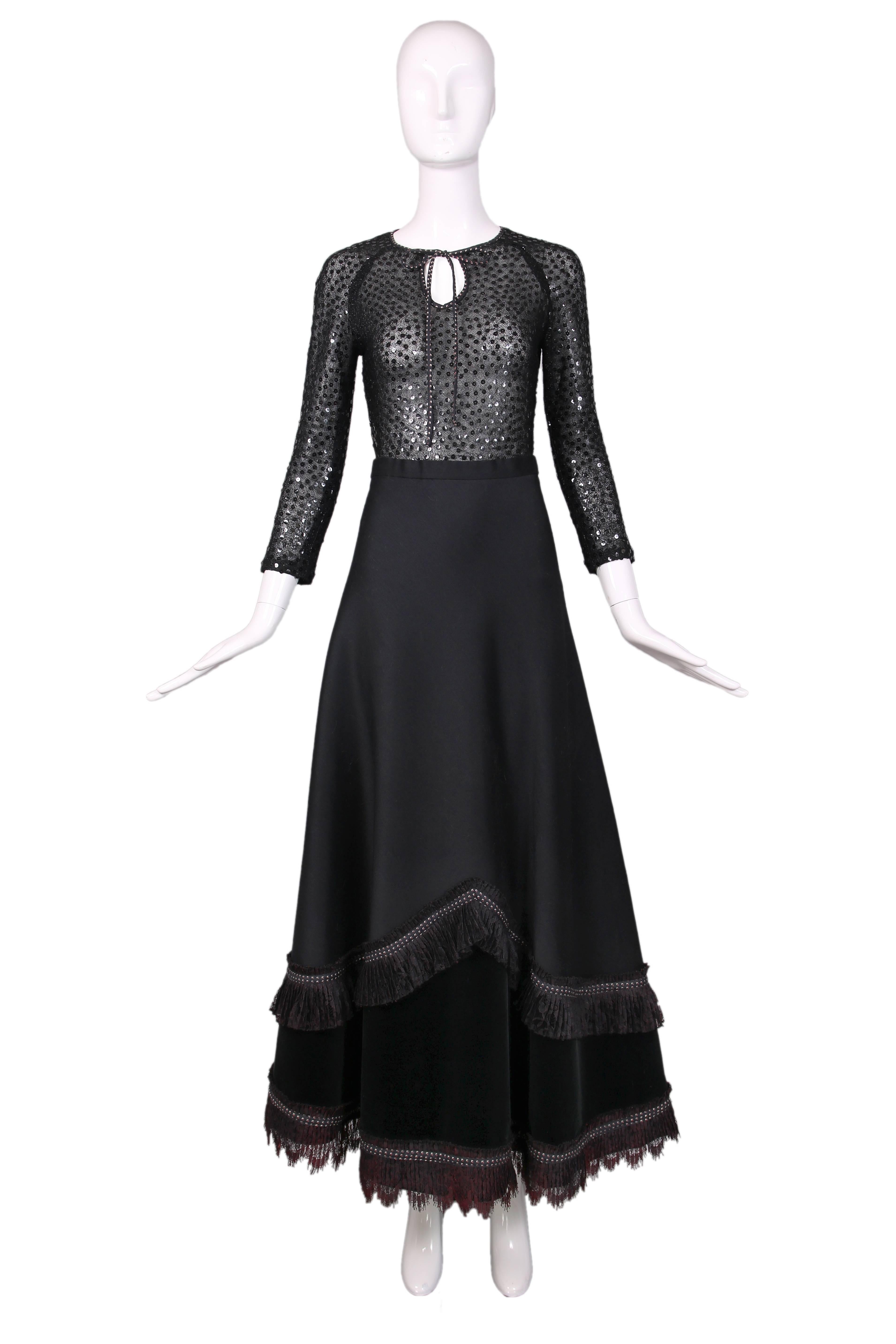 Koos Van Den Akker black sheer fitted sequin blouse with keyhole formed by neck ties and maxi skirt with lace and velvet trim. Blouse has a raglan sleeve. In excellent condition. No size tag, please consult measurements. No label inside blouse, only