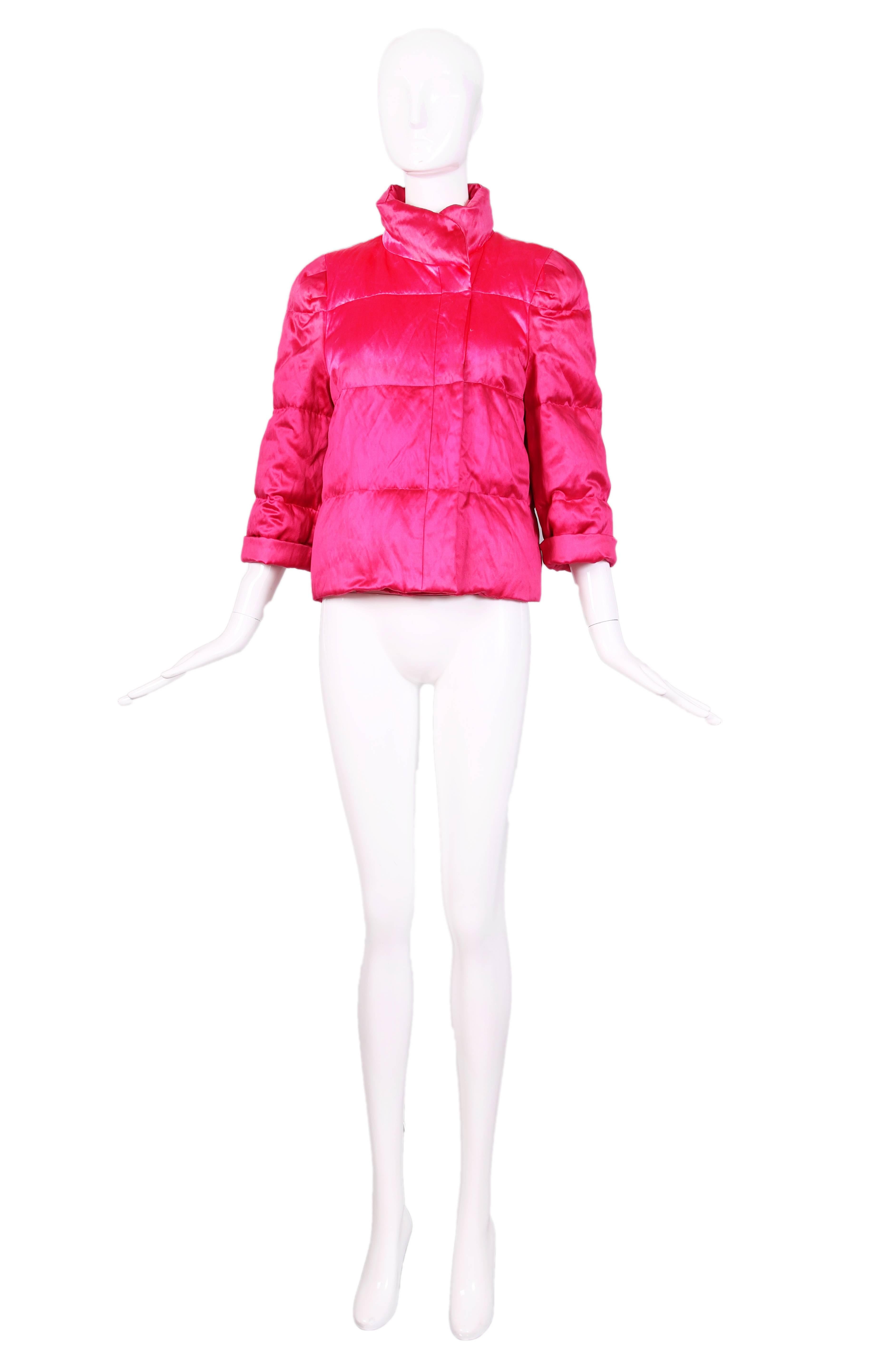 Dries Van Noten hot pink silk and cotton blend puffer jacket with hook and eye closures and pocket at interior. Filling is 80% down and 20% feathers. In excellent condition and original tags priced at $1,410. Size EU 40.
MEASUREMENTS (in