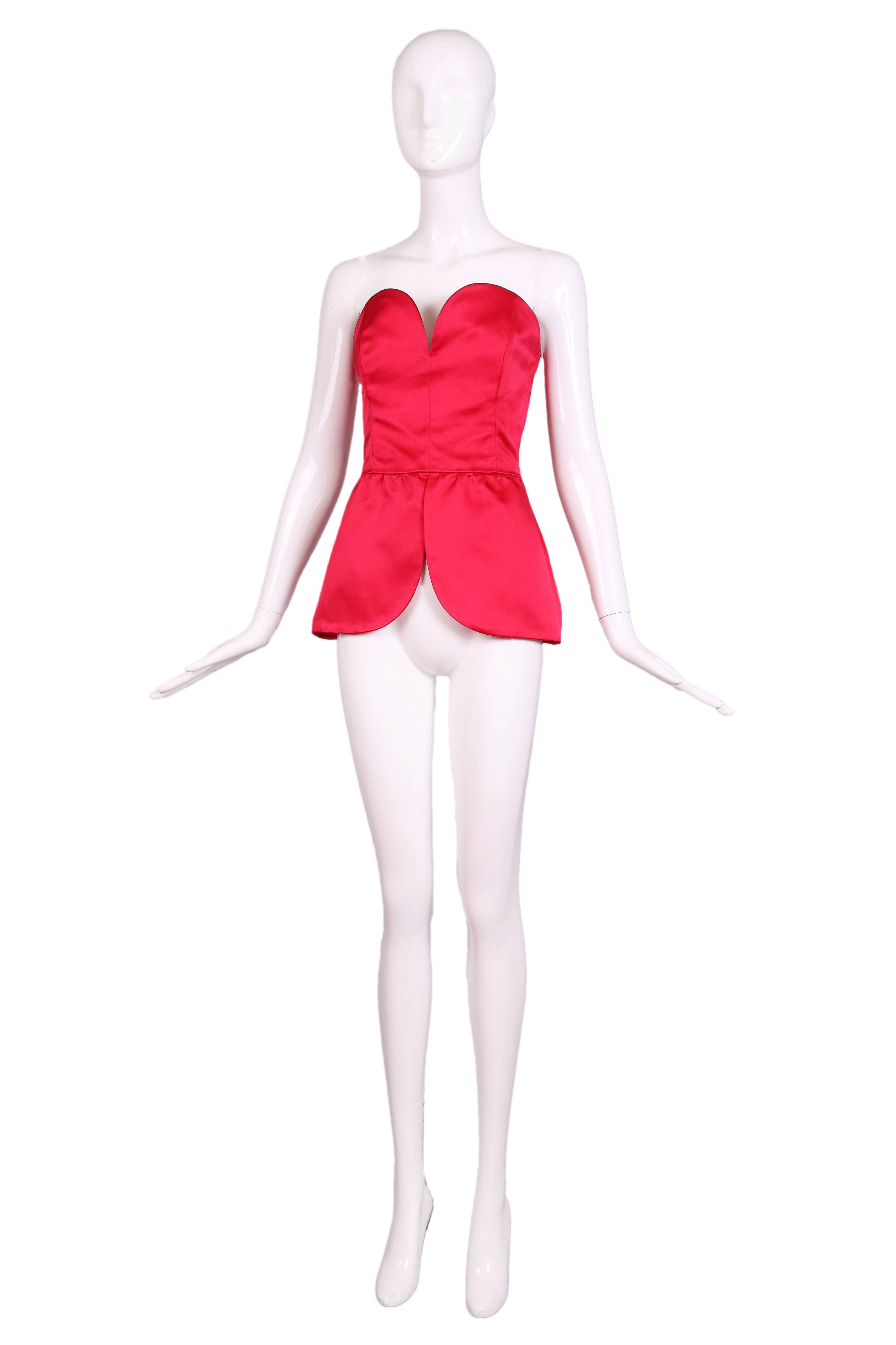 Vintage Yves Saint Laurent hot pink satin bustier with sweetheart neckline and peplum waist. In excellent condition. Size EU 38.
MEASUREMENTS (in inches):
Bust - 34/36
Waist - 27
Length - 19