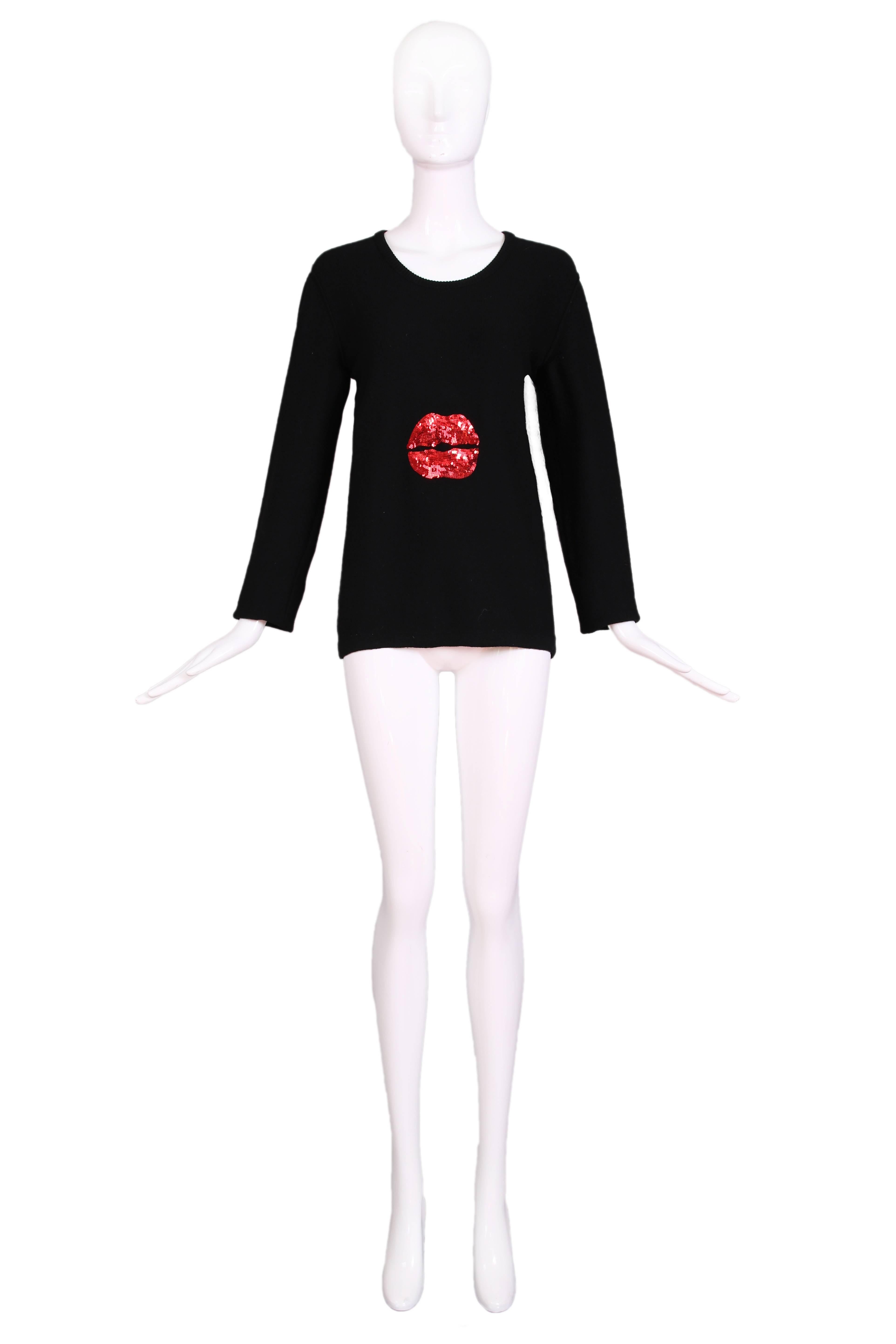 Vintage Sonia Rykiel black scoop neck sweater with long sleeves and an appliqué of red sequin lips as the frontal design element. The sweater is 90% wool and 10% cashmere. Size tag 40. In excellent condition. 
MEASUREMENTS:
Bust - 34