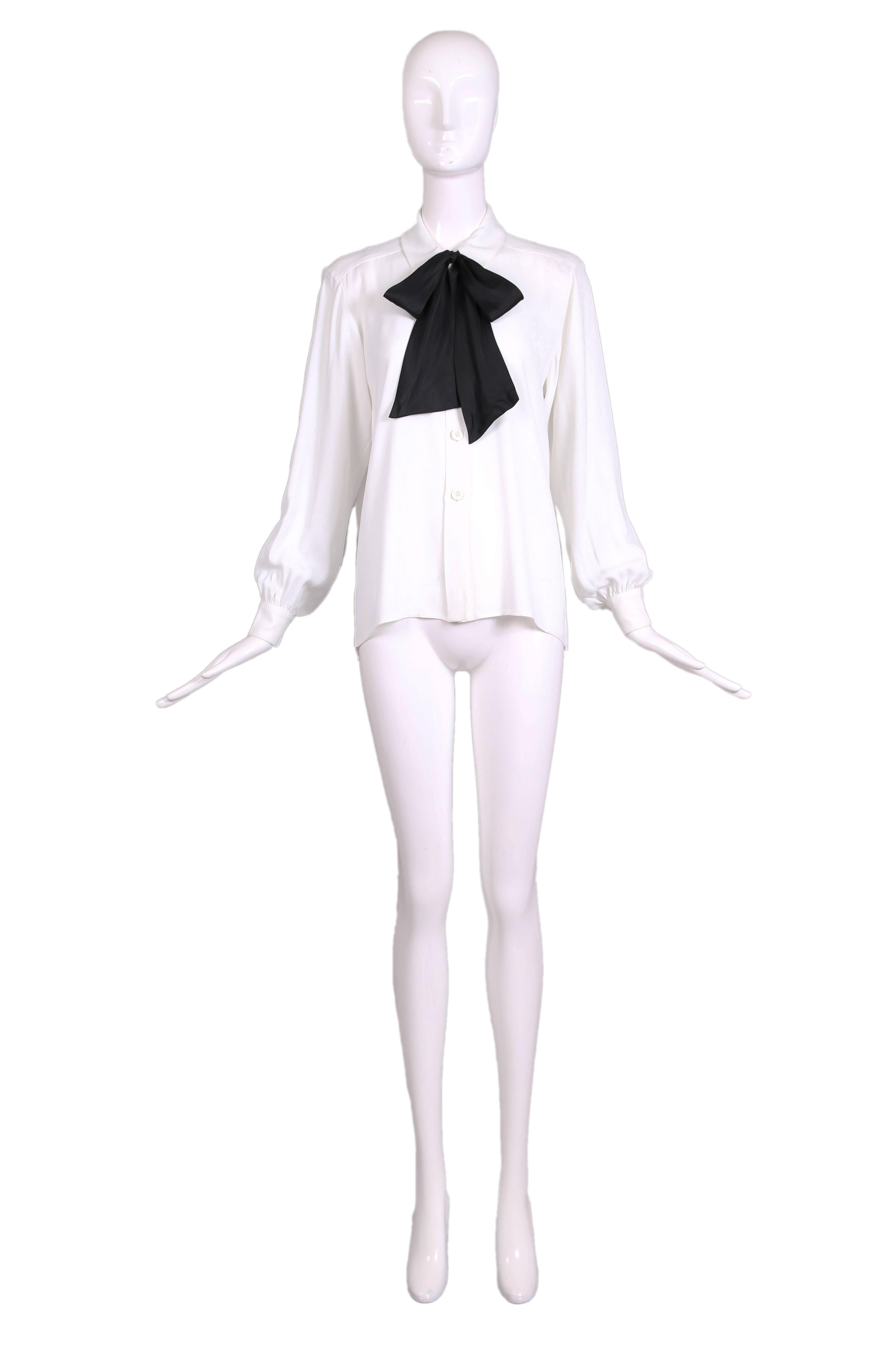 Vintage Yves Saint Laurent classic white blouse in soft crepe with black bow at the neck. The blouse has long sleeves with soft gathers around the 2