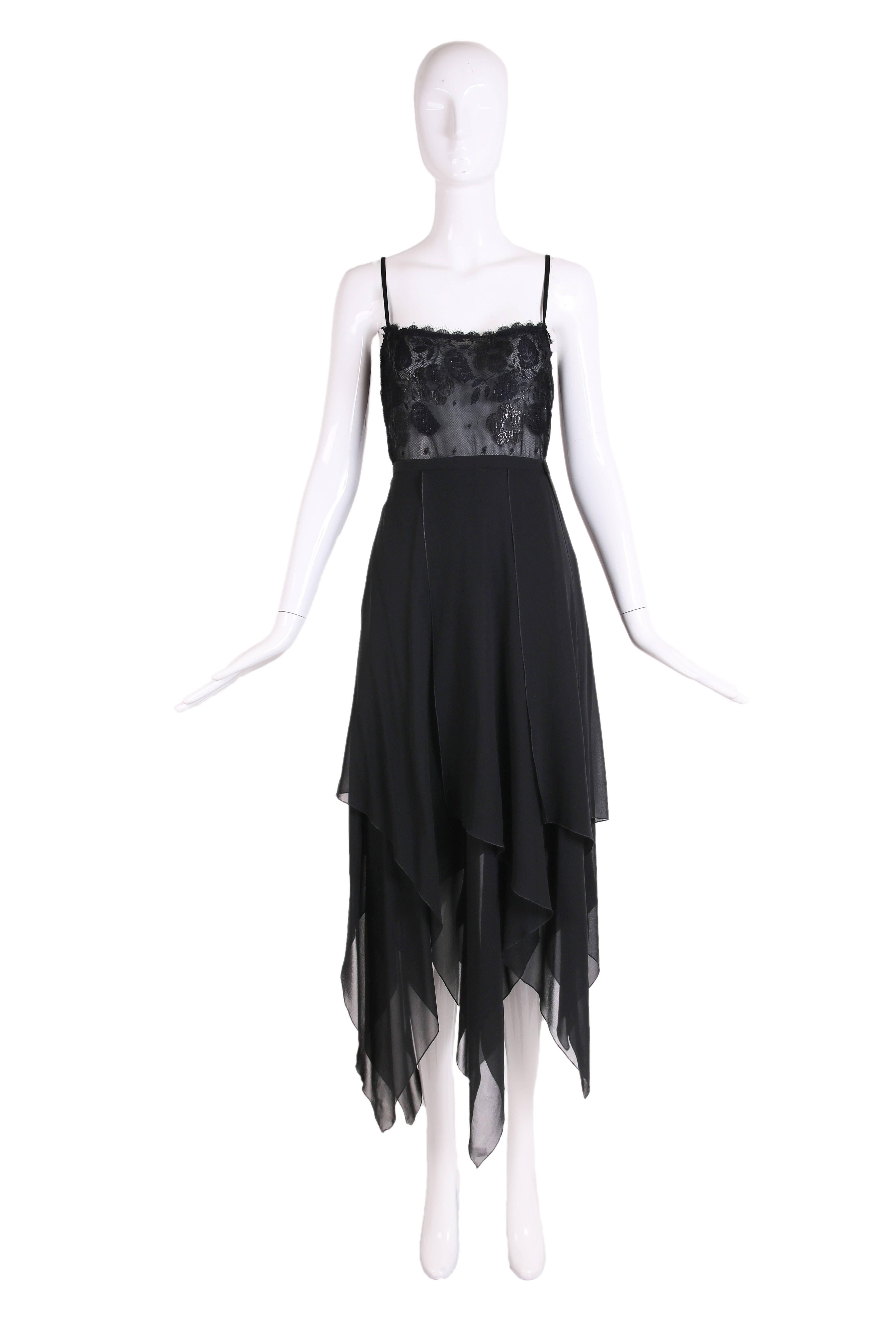 1970's Guy Laroche black metallic lace spaghetti strap camisole with black chiffon multi-layered skirt featuring a hanky hem. In excellent condition. Skirt size tag 42 - top has no tag. Please consult measurements.
MEASUREMENTS:
Top
Bust - 36