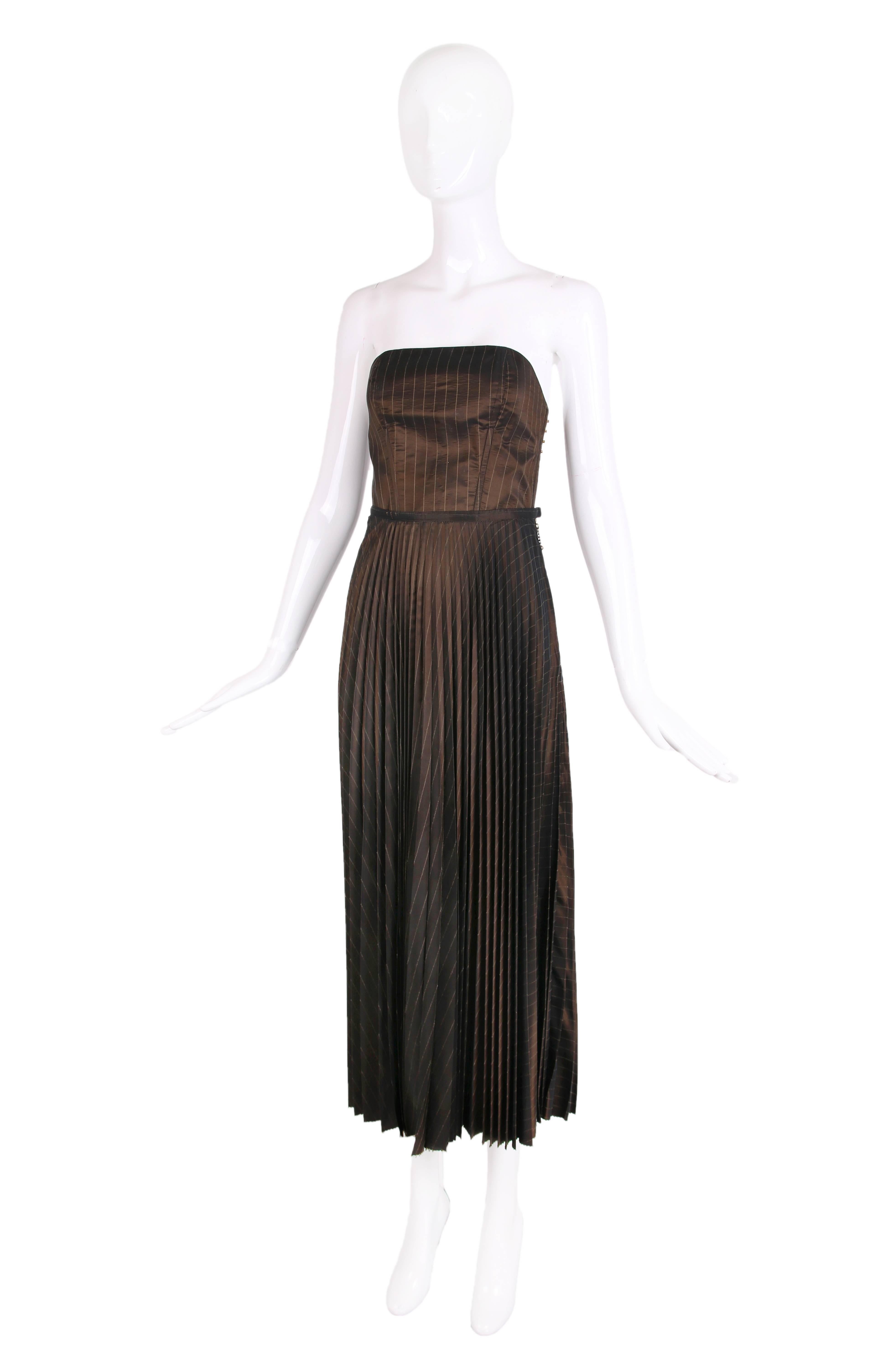 1990's Jean Paul Gaultier brown striped bustier and pleated skirt ensemble. In excellent condition. Please see measurements. 
MEASUREMENTS:
Top:
Bust - 34"
Waist - 23"
Length - 10"
Skirt:
Waist - 28"
Hip - Free
Length - 37"