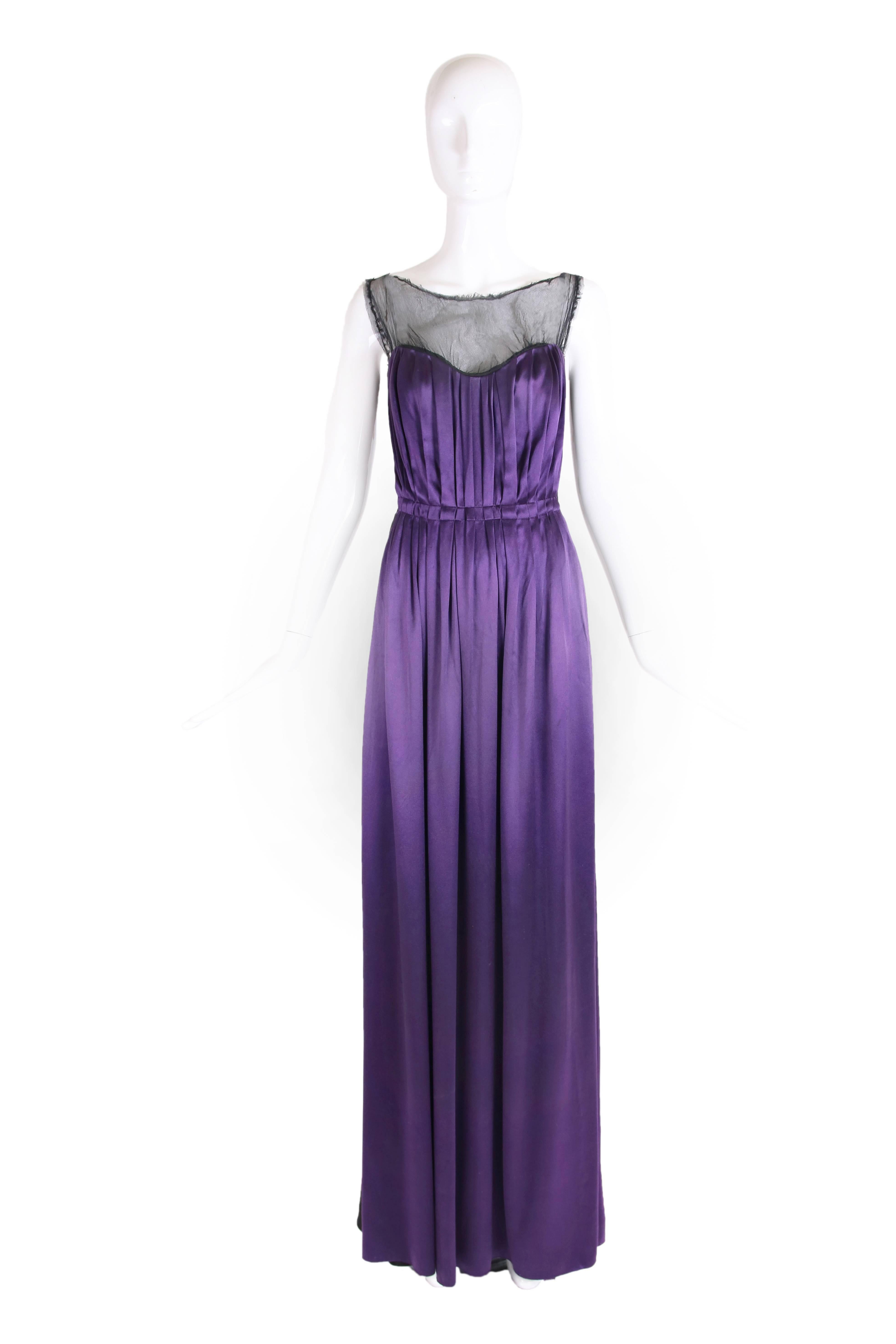 2006 Lanvin dramatic evening gown made of wool, satin and sheer silk tulle. Gown in constructed from pleated purple satin at the front, black stretch wool at the back and sheer black silk tulle at the interior that forms the gathered transparent