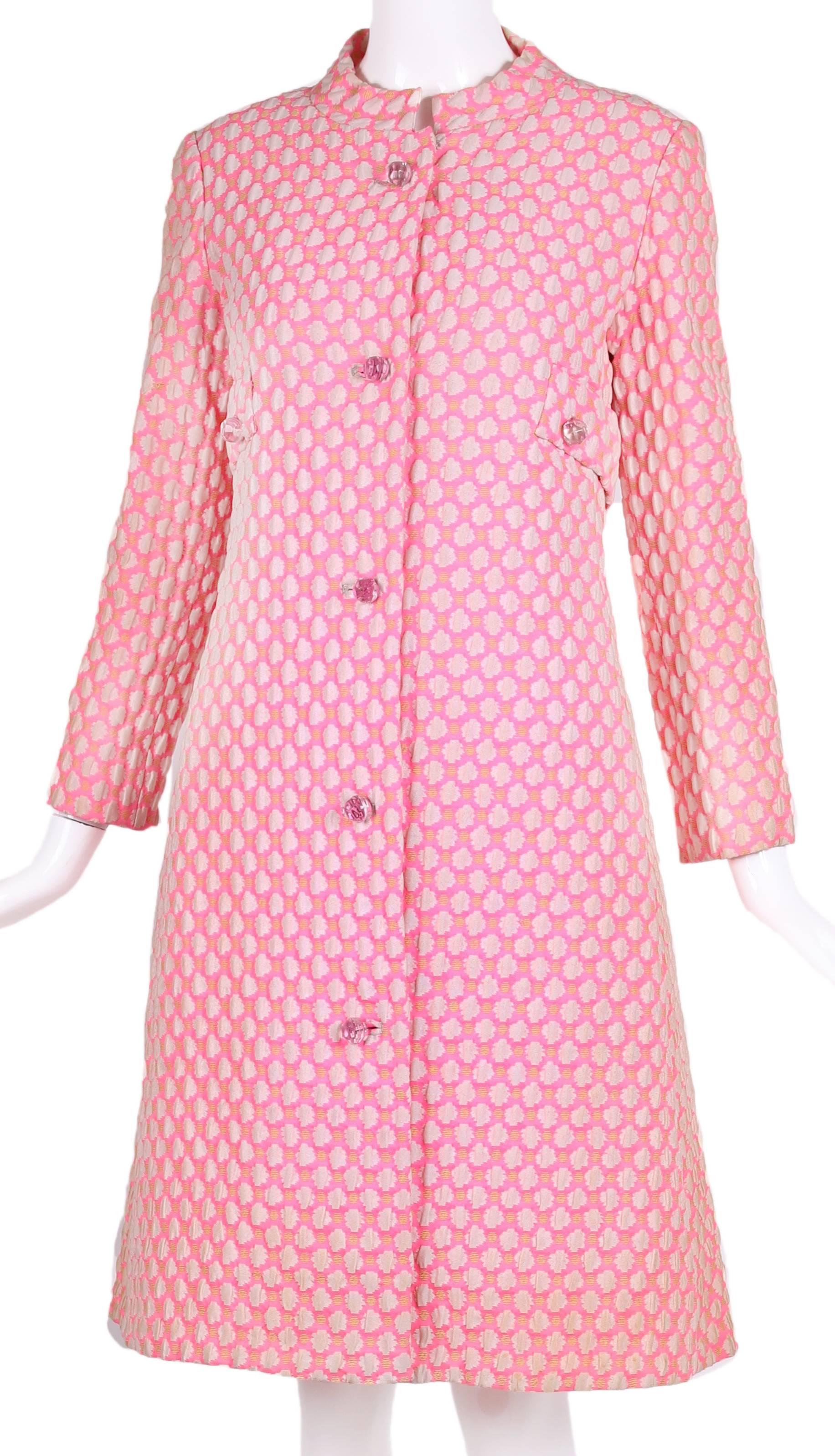 1960's Guy Laroche by Maria Carine bubblegum pink and off-white and ochre patterned coat with stand collar, clear faceted lucite buttons and hidden side pockets. Fully lined, in excellent condition. No size tag, please consult
