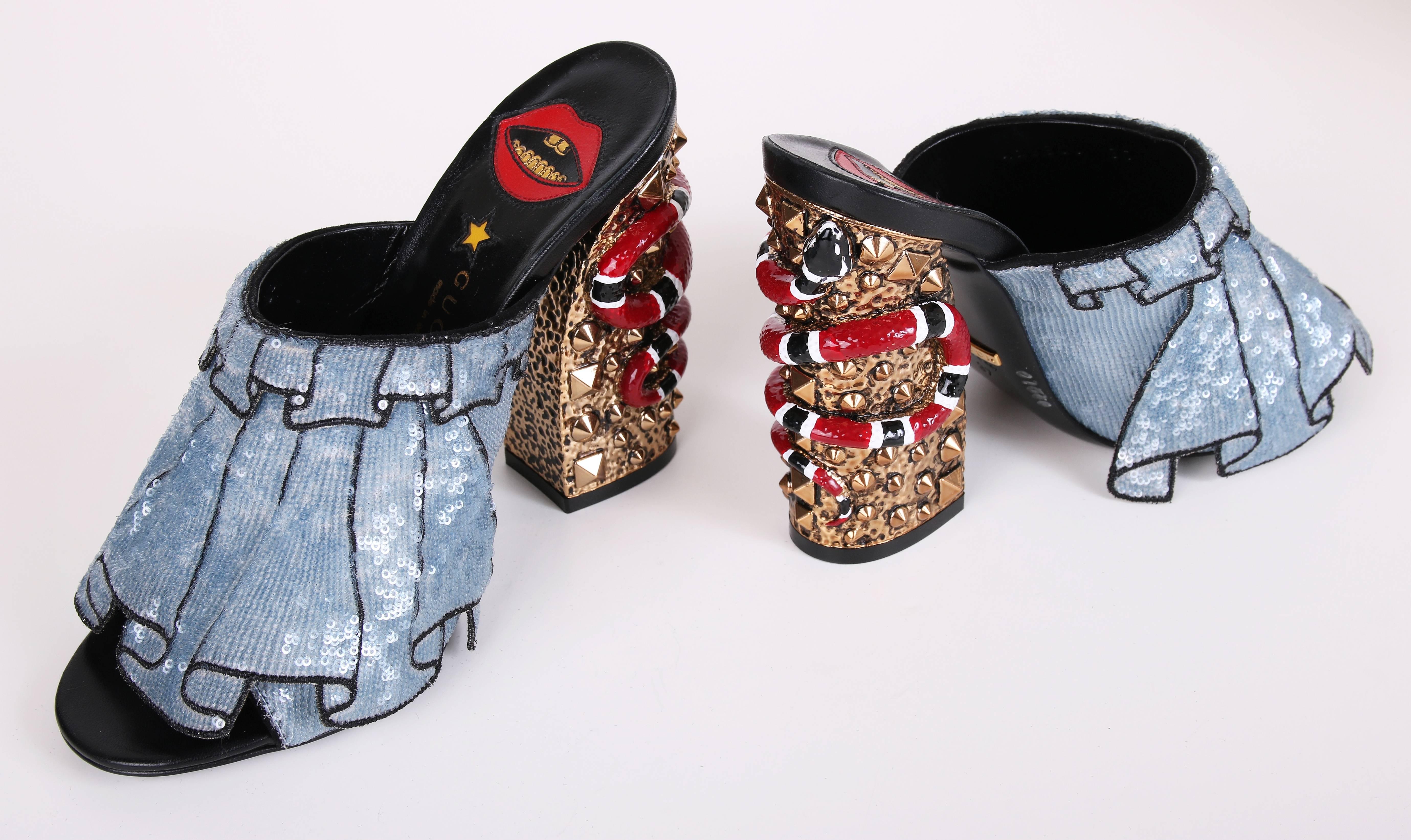 Spring 2016 Gucci trompe l'oeil light blue sequined Owen ruffles block-heel mules with snakes at heel. Heel is made of hammered gold tone metal and gold studs. Shoes have never been worn - in perfect condition. Size 37