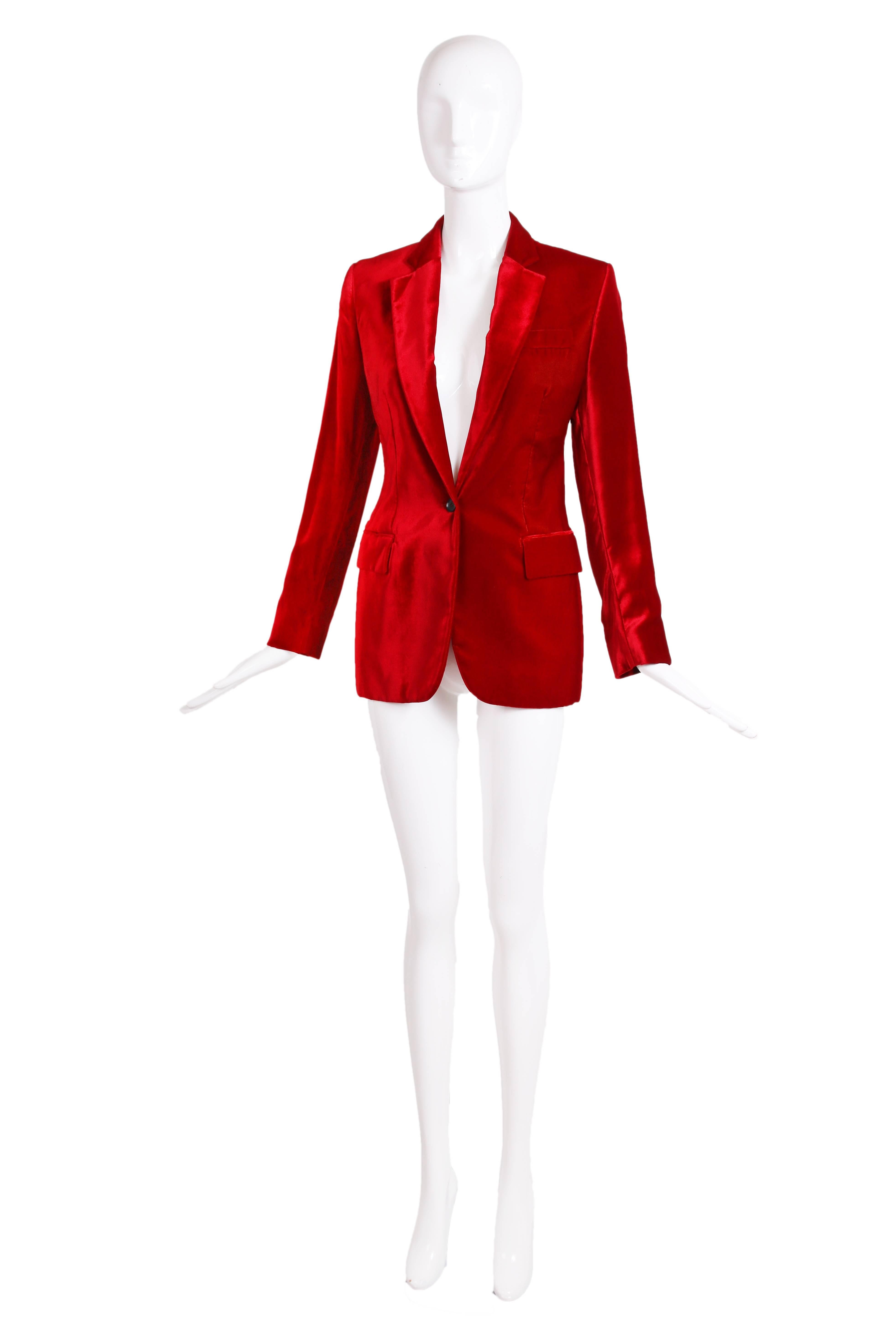 1999 Gucci by Tom Ford deep red velvet jacket with slim fit and single button closure at waist. Jacket has two frontal pockets at waist, breast pocket, interior pocket, vent at back and buttons at the wrist cuffs. Fully lined. In excellent condition