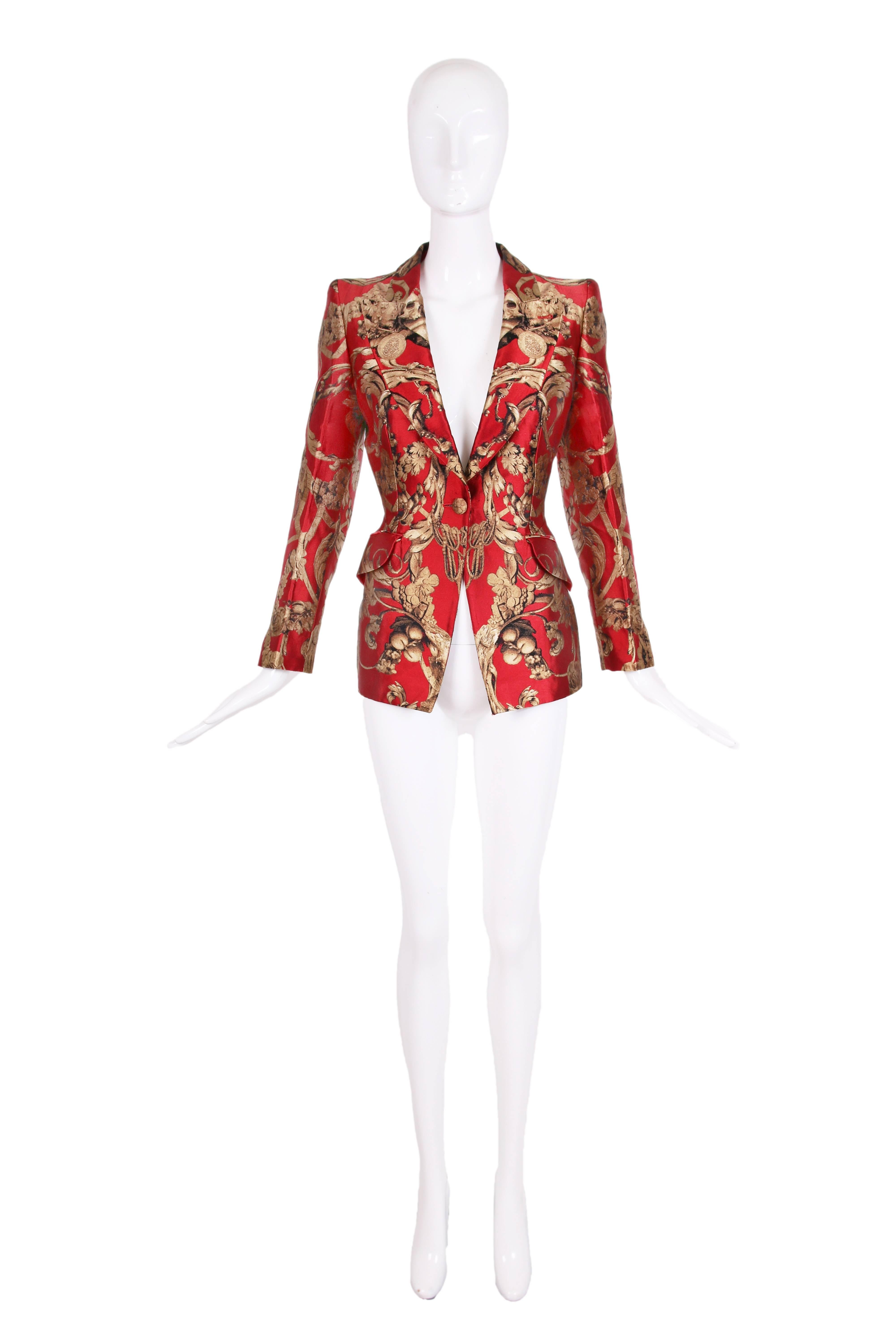 2010 Alexander McQueen silk red and gold foliate print w/medallions fitted blazer with single button and two frontal pockets. In excellent condition. Size 42 - please consult measurements.
MEASUREMENTS:
Shoulders - 15"
Sleeves - 23"
Bust -