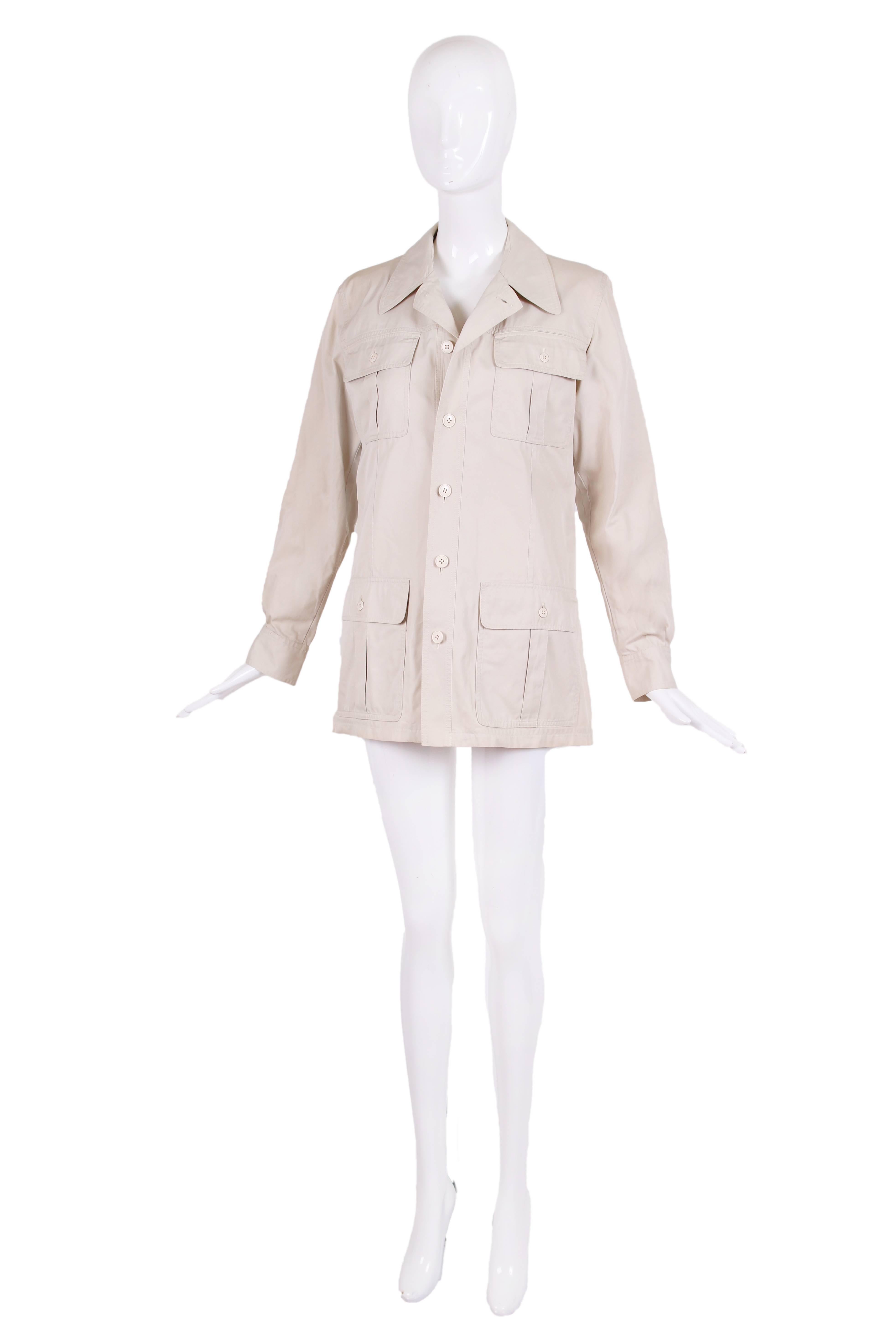 1970's Yves Saint Laurent off white/creme 100% cotton safari jacket with four frontal pockets, a vent at the back, notched collar and barrel cuffs with two buttons. In excellent condition - no size tag please see