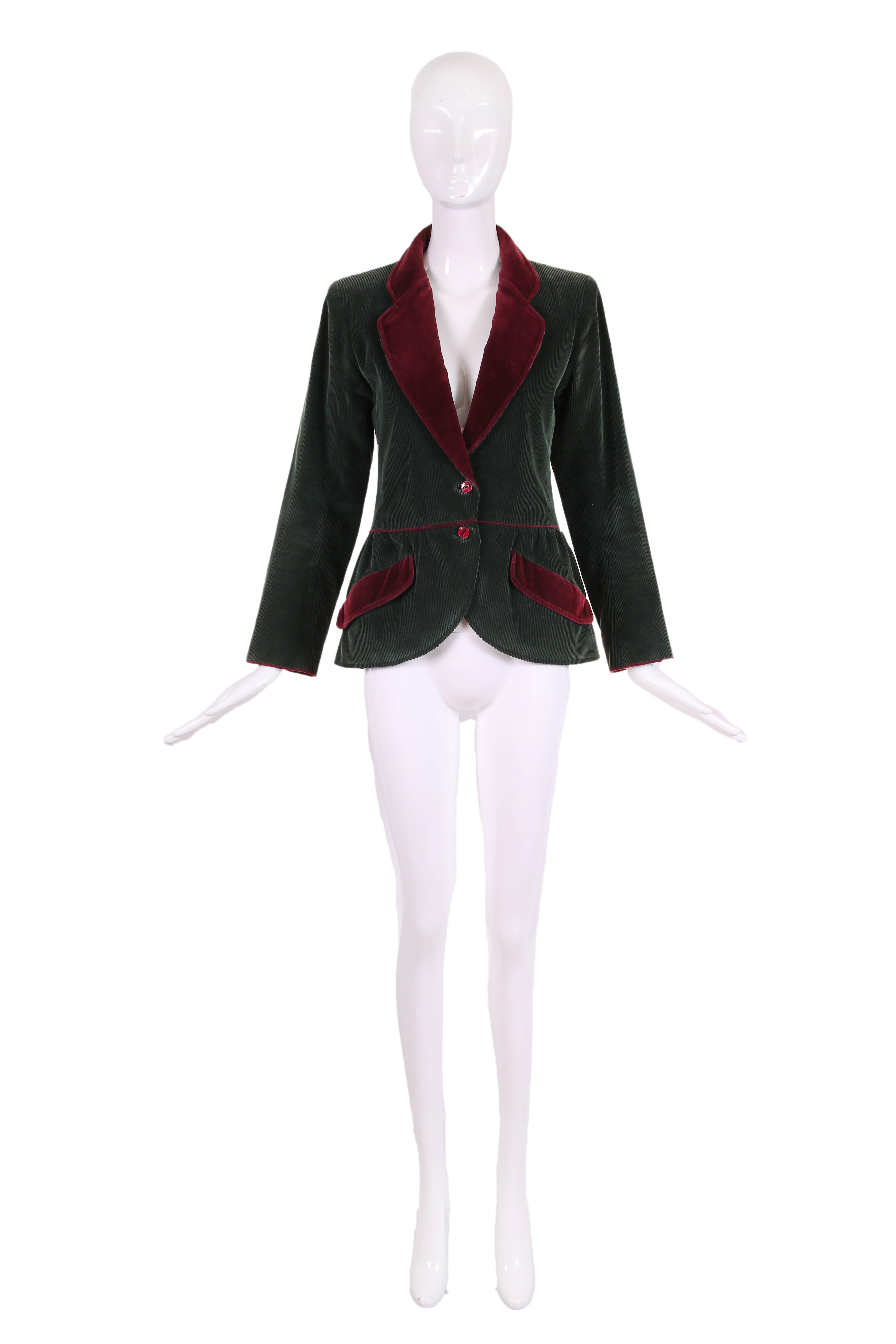 Yves Saint Laurent dark green long sleeve 100% cotton corduroy jacket with burgundy velvet trim and peplum waist. Features two frontal slanted pockets, burgundy button closures at waist and cuff and is fully lined at the interior. In excellent