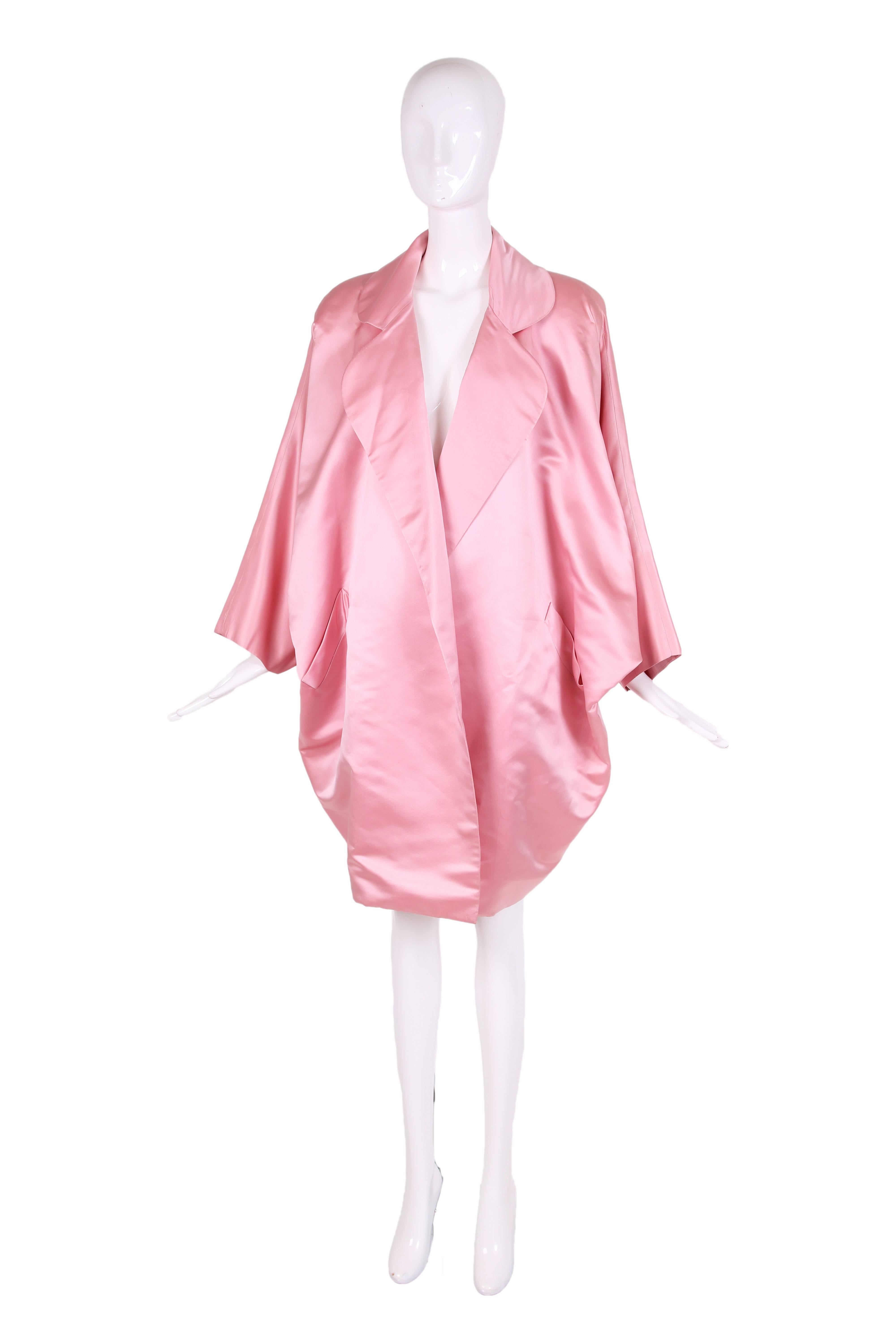 Bill Blass pink silk satin oversized cocoon coat with dolman sleeves, clover lapels and pockets. In excellent condition - no size tag. Will fit a variety of sizes.