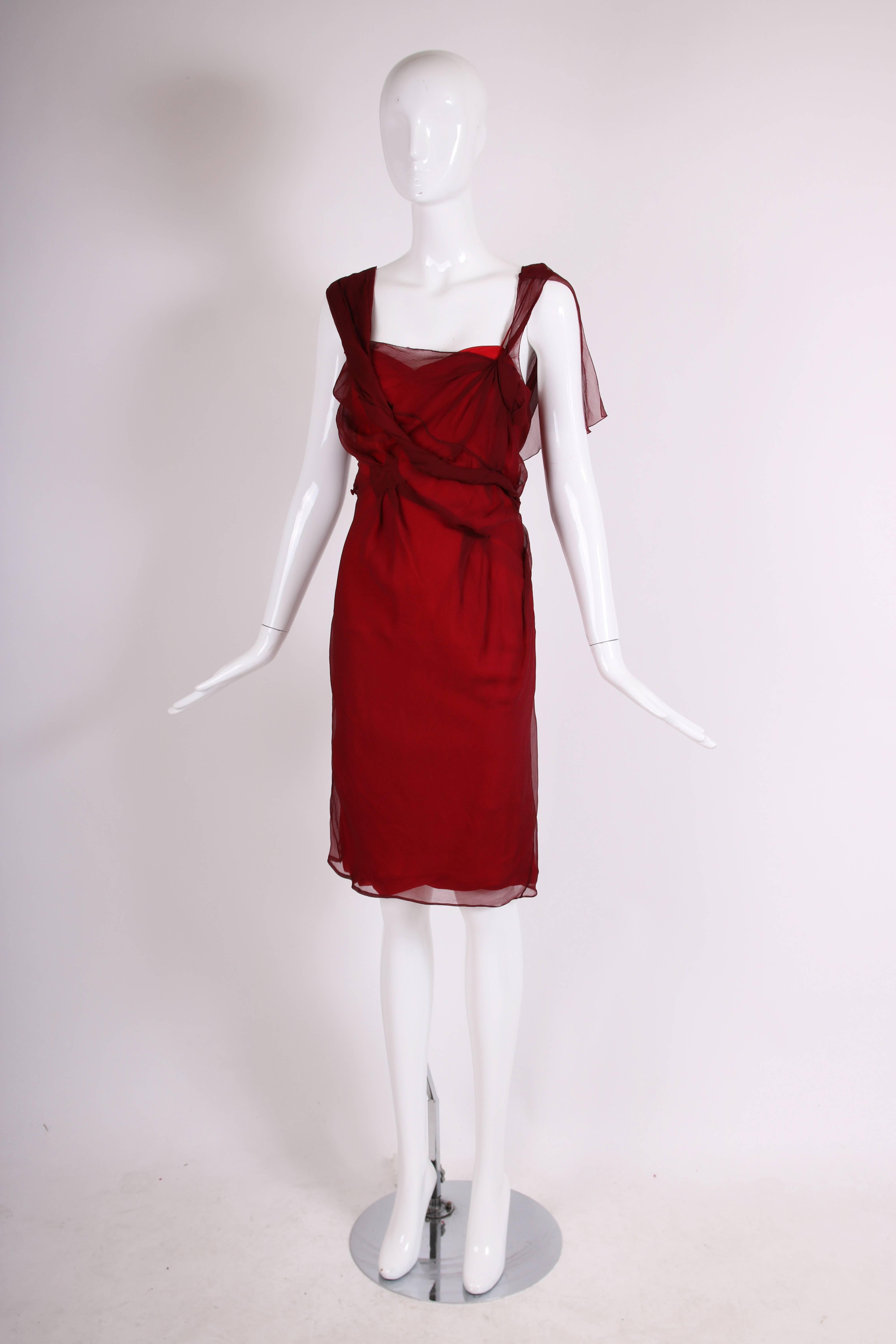 Christian Dior by John Galliano burgundy chiffon double layered cocktail dress with asymmetric fabric pattern at top layer. In excellent condition - no size tag, please consult measurements. 
MEASUREMENTS:
Bust - approx. 30-32