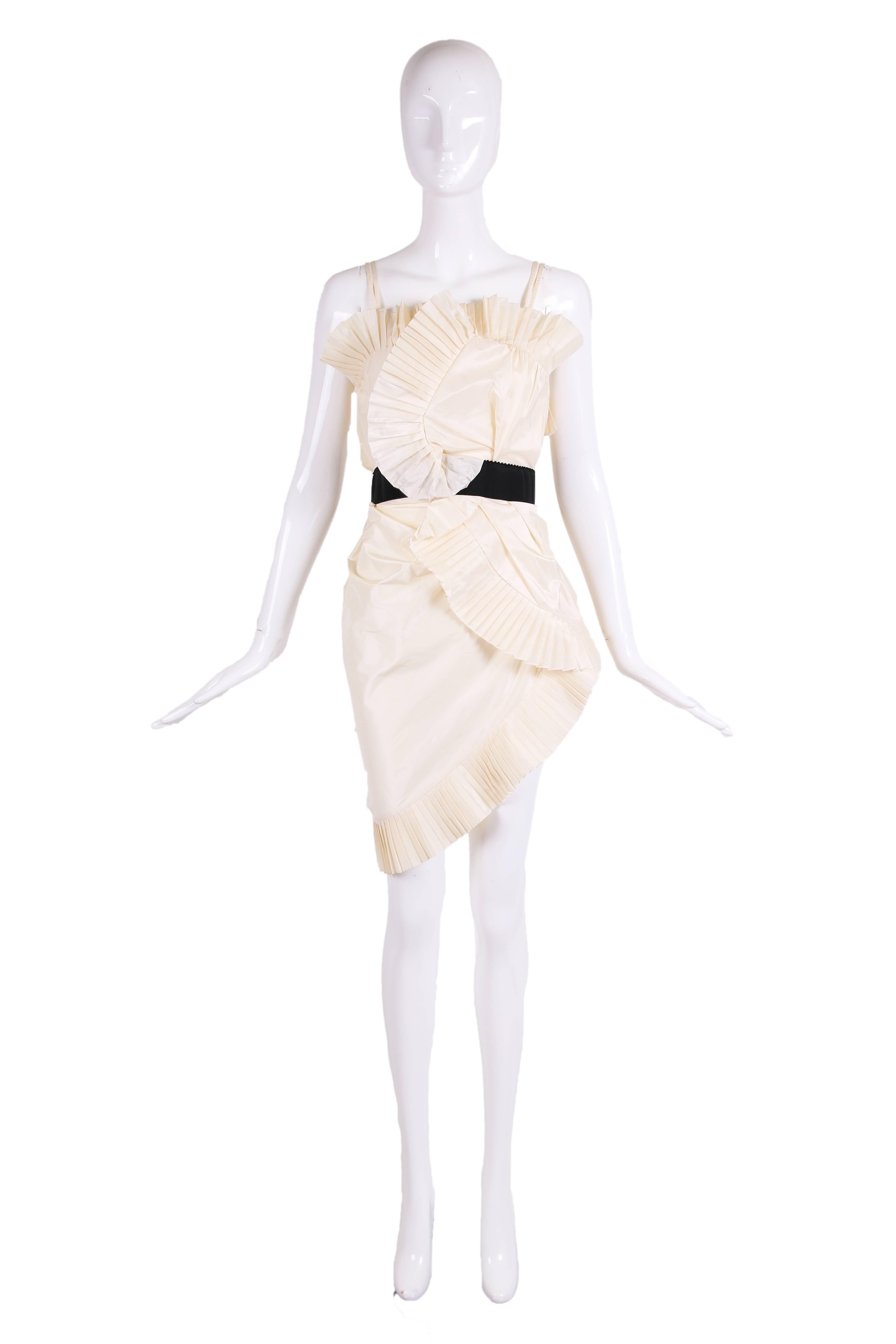 Incredible Christian Dior cocktail dress by John Galliano made of creme silk taffeta fabric and pleated trim. In excellent condition - US size 6 but it appears to fit more like a size 4 or size 2 - please consult measurements.